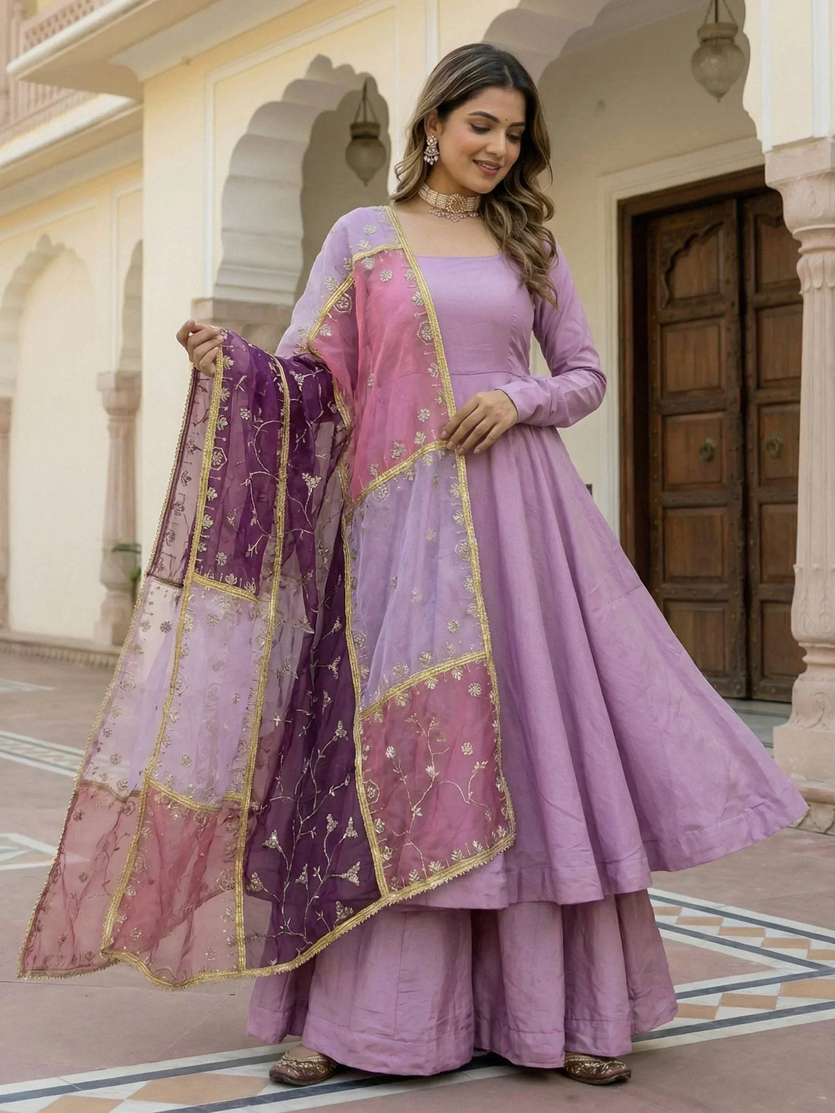 Lavender anarkali suit with ombre dupatta, gold embroidery, and flared skirt for Indian ethnic wear