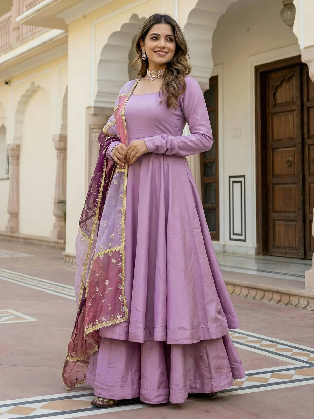 Elegant lavender anarkali suit with gold embroidery and matching dupatta, perfect for Indian ethnic occasions.