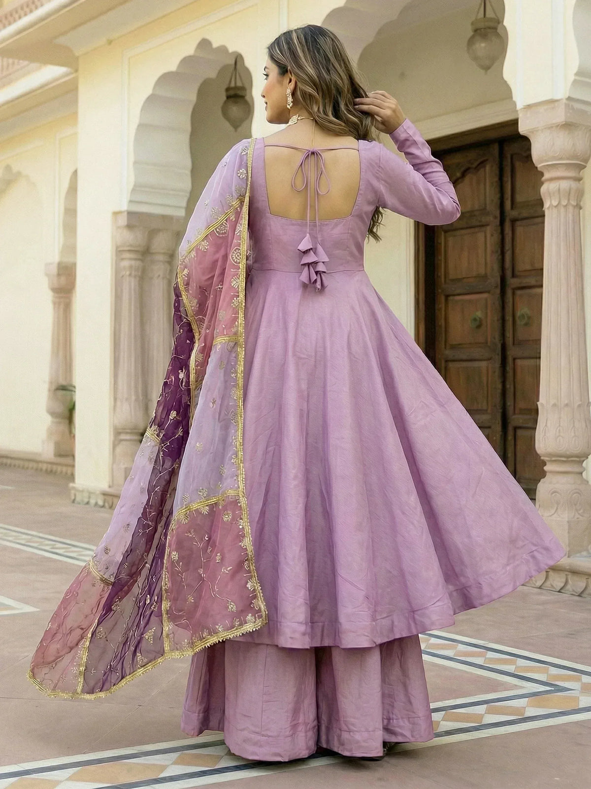 Lavender ethnic anarkali with gold embroidery and matching dupatta, perfect for Indian festive occasions.