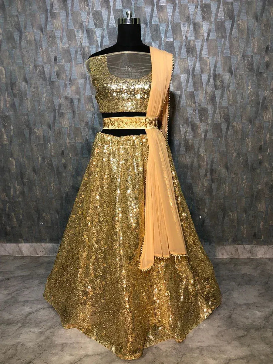 Gold sequin lehenga choli with sheer blouse and peach dupatta, ethnic Indian party wear