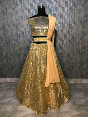 Bewitching Golden Net Sequins Work Lehenga Choli With Dupatta