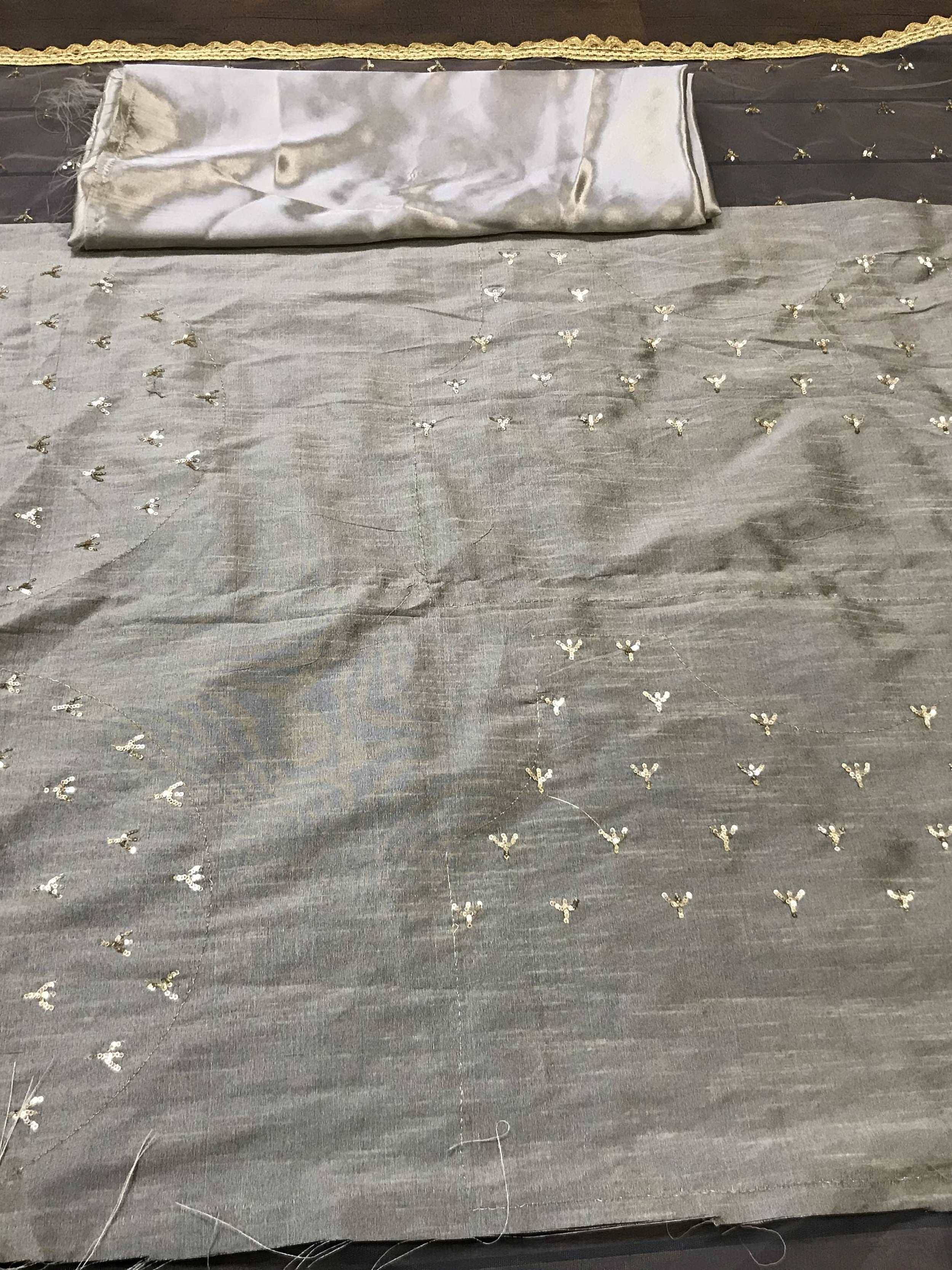 Grey ethnic gown fabric with gold sequin embroidery and matching dupatta, ideal for designer wear.