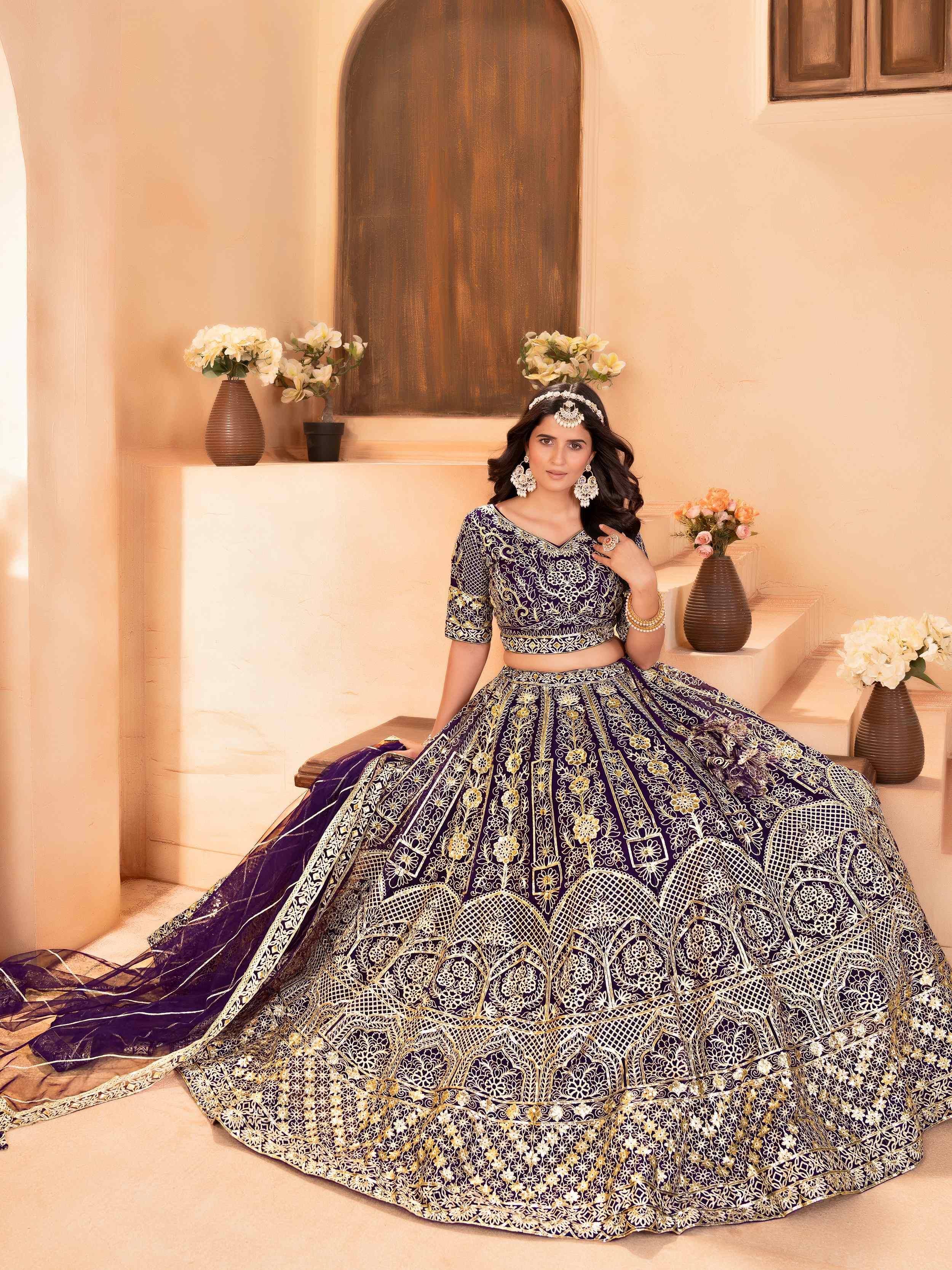Enchanting Purple Zari Embroidered Net Reception Wear Lehenga Choli