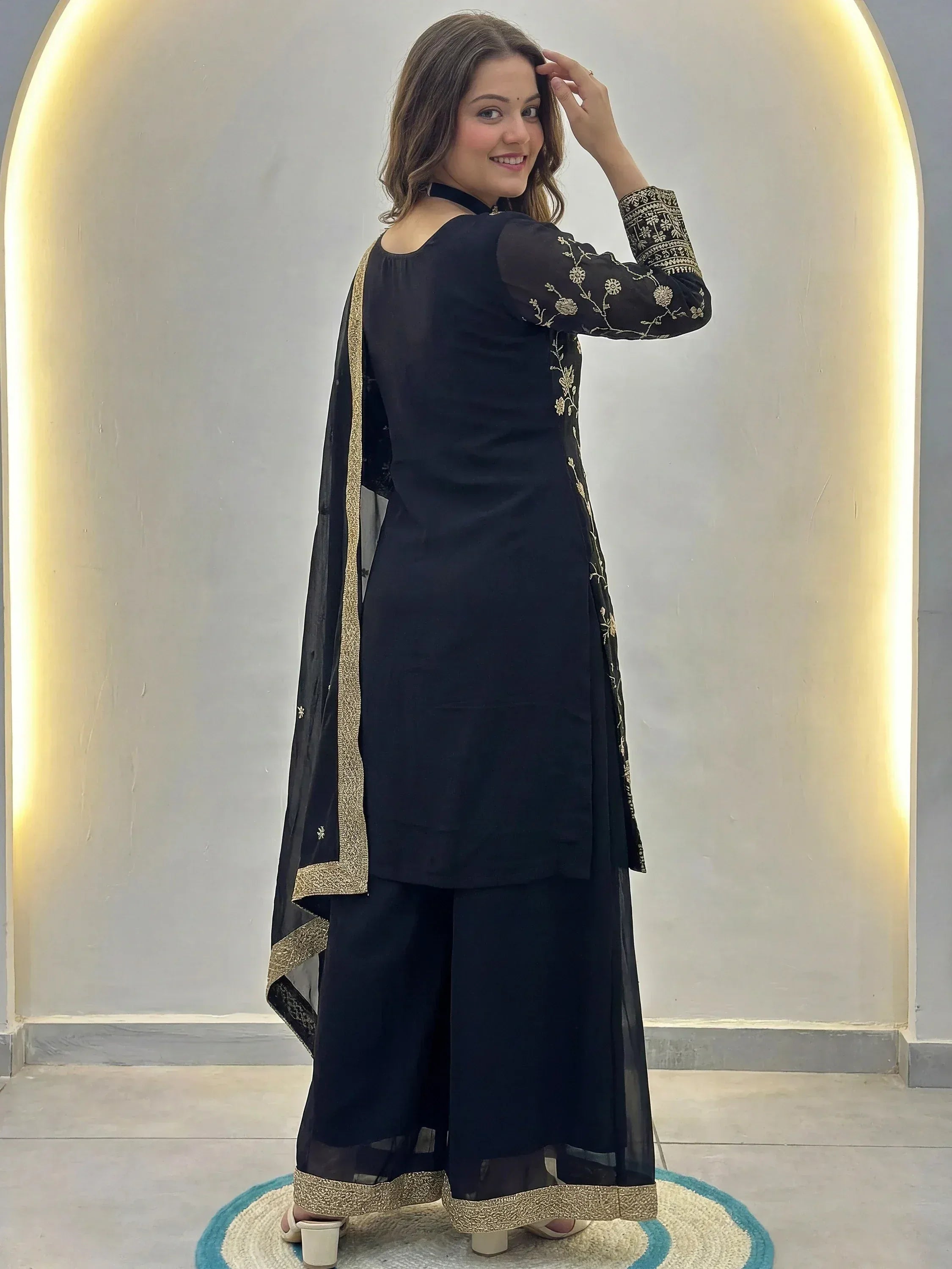 Black embroidered salwar kameez with gold detailing, stylish ethnic wear for women