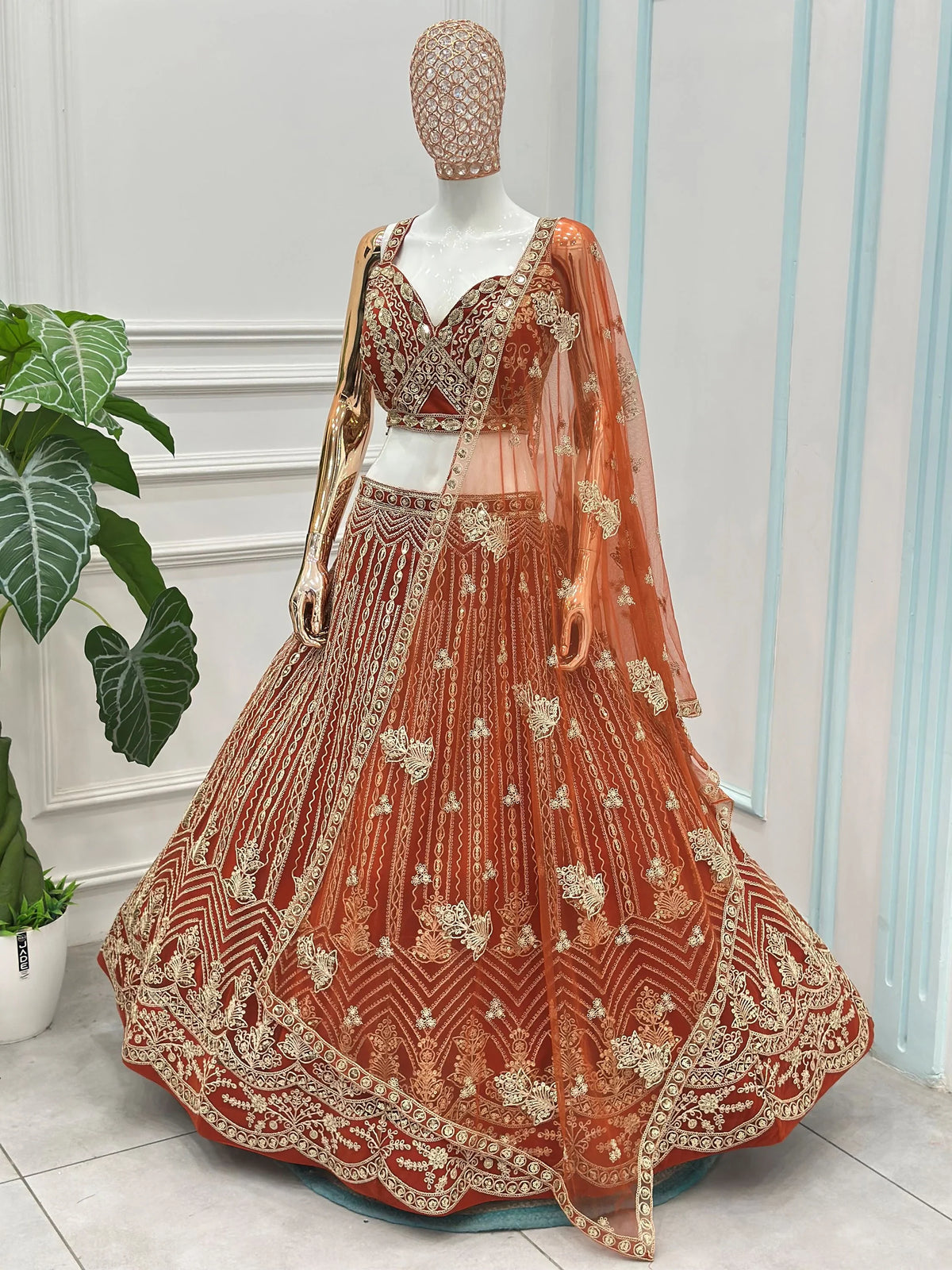 Grand Orange Heavy Embroidered Net Reception Wear Lehenga Choli