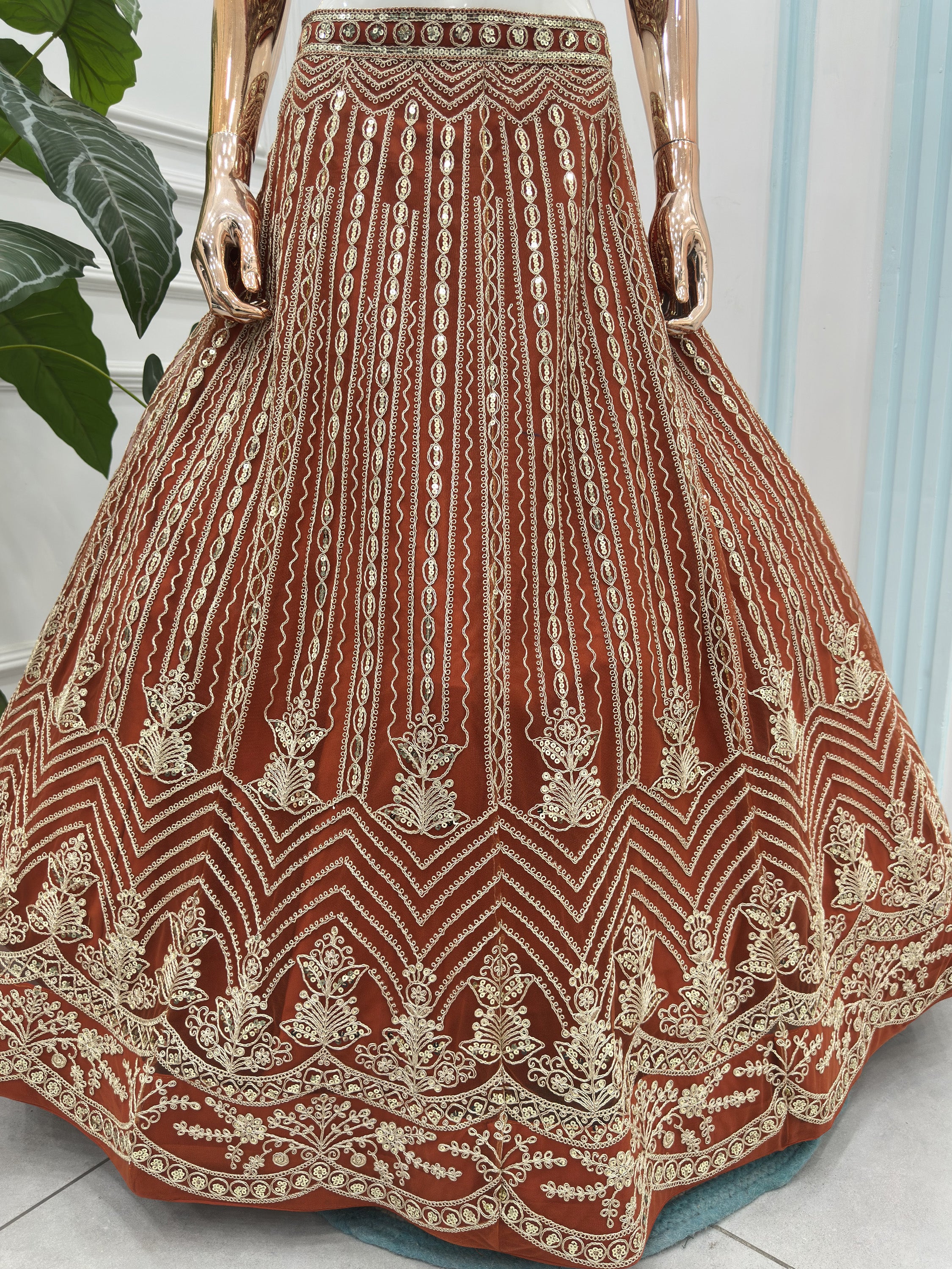 Grand Orange Heavy Embroidered Net Reception Wear Lehenga Choli
