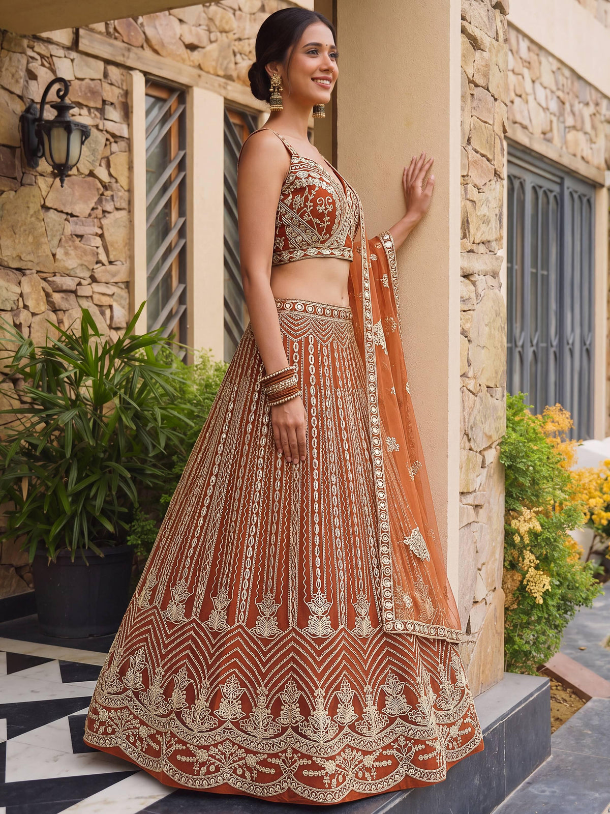 Grand Orange Heavy Embroidered Net Reception Wear Lehenga Choli