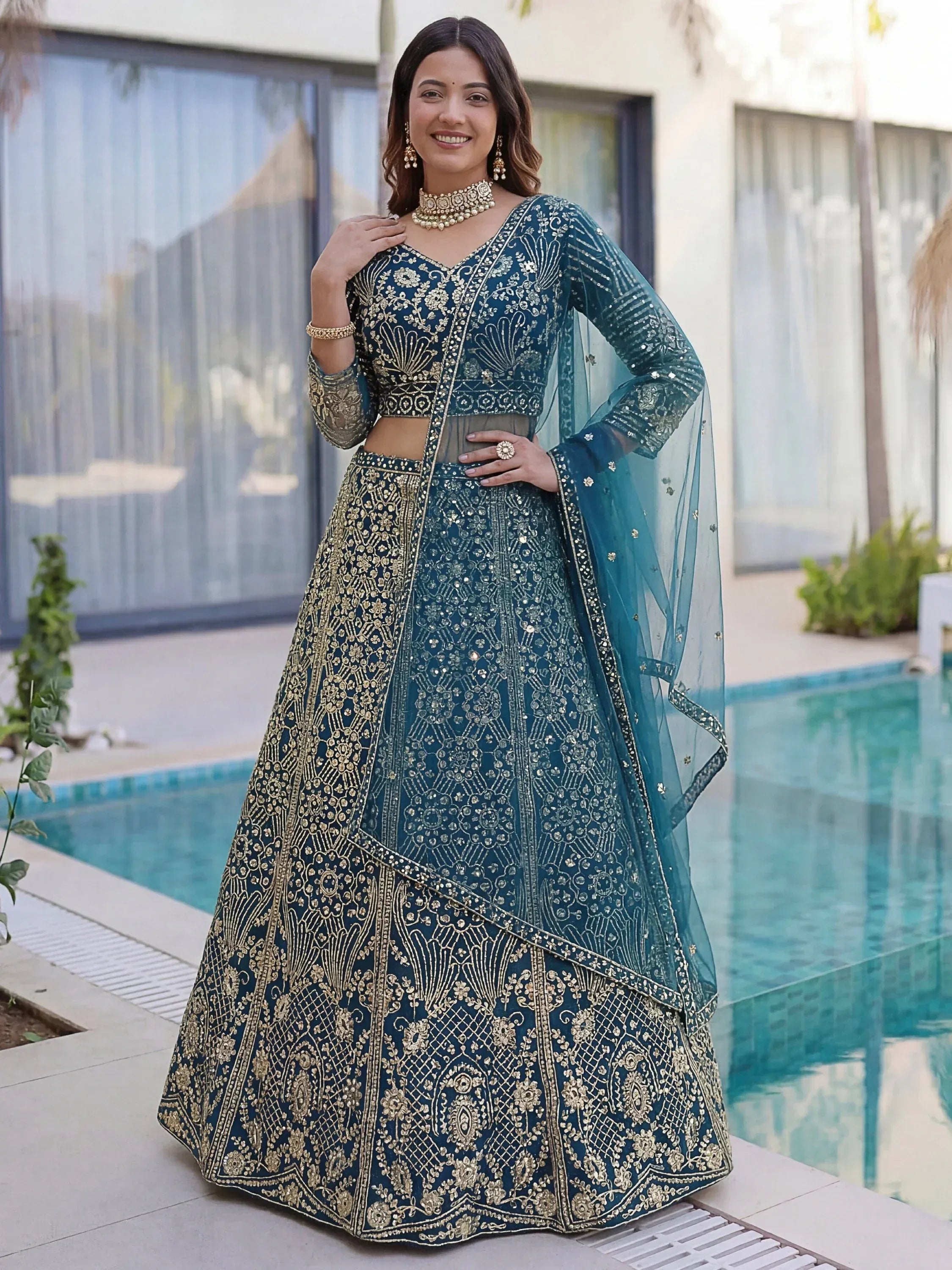 Splendid Teal Blue Sequins Net Party Wear Lehenga With Blouse
