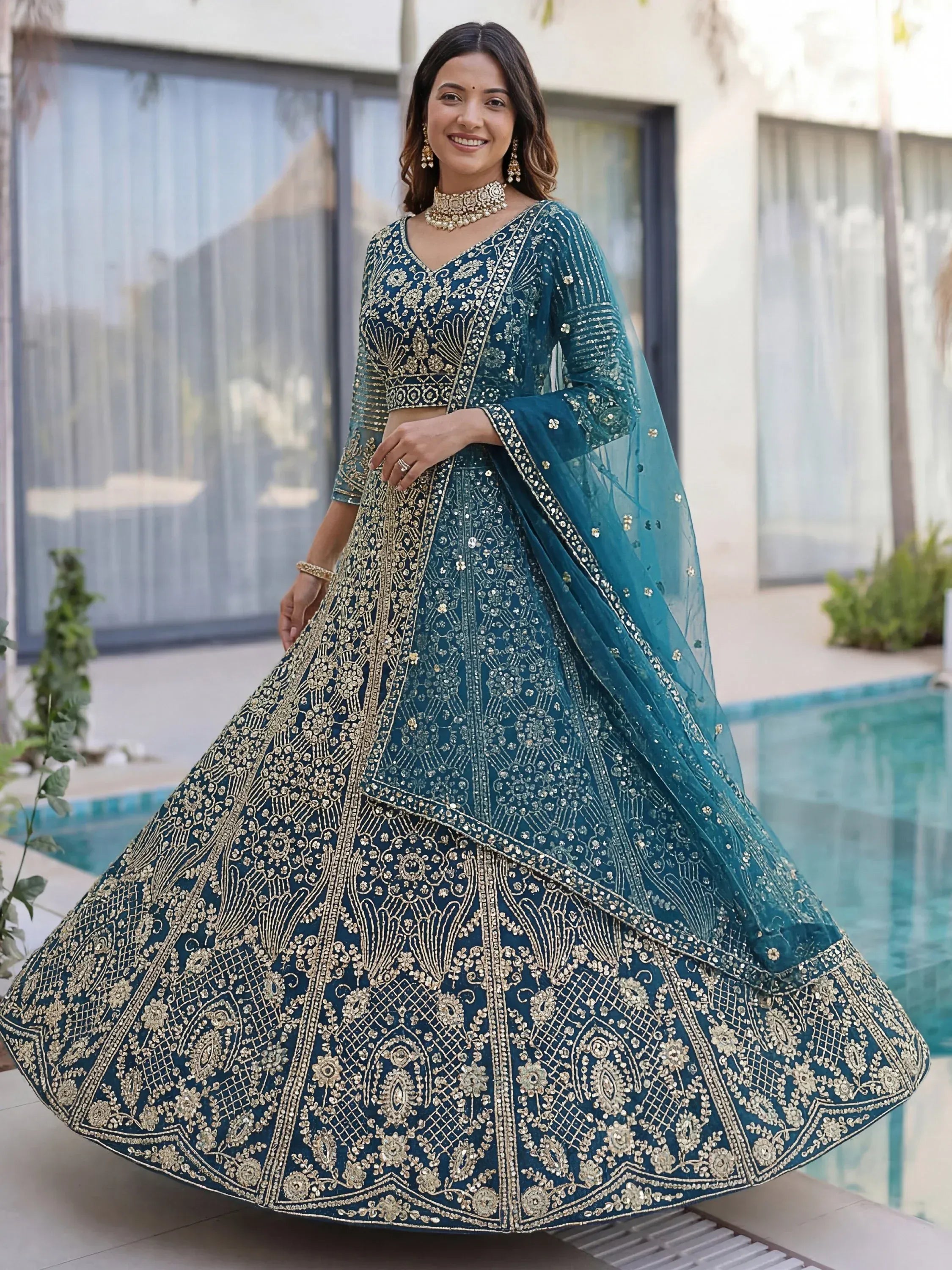 Splendid Teal Blue Sequins Net Party Wear Lehenga With Blouse
