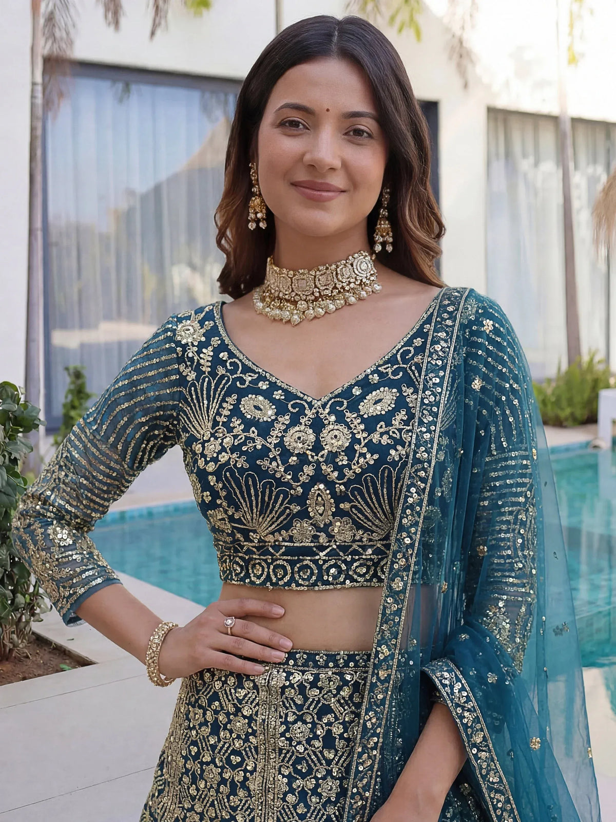 Splendid Teal Blue Sequins Net Party Wear Lehenga With Blouse