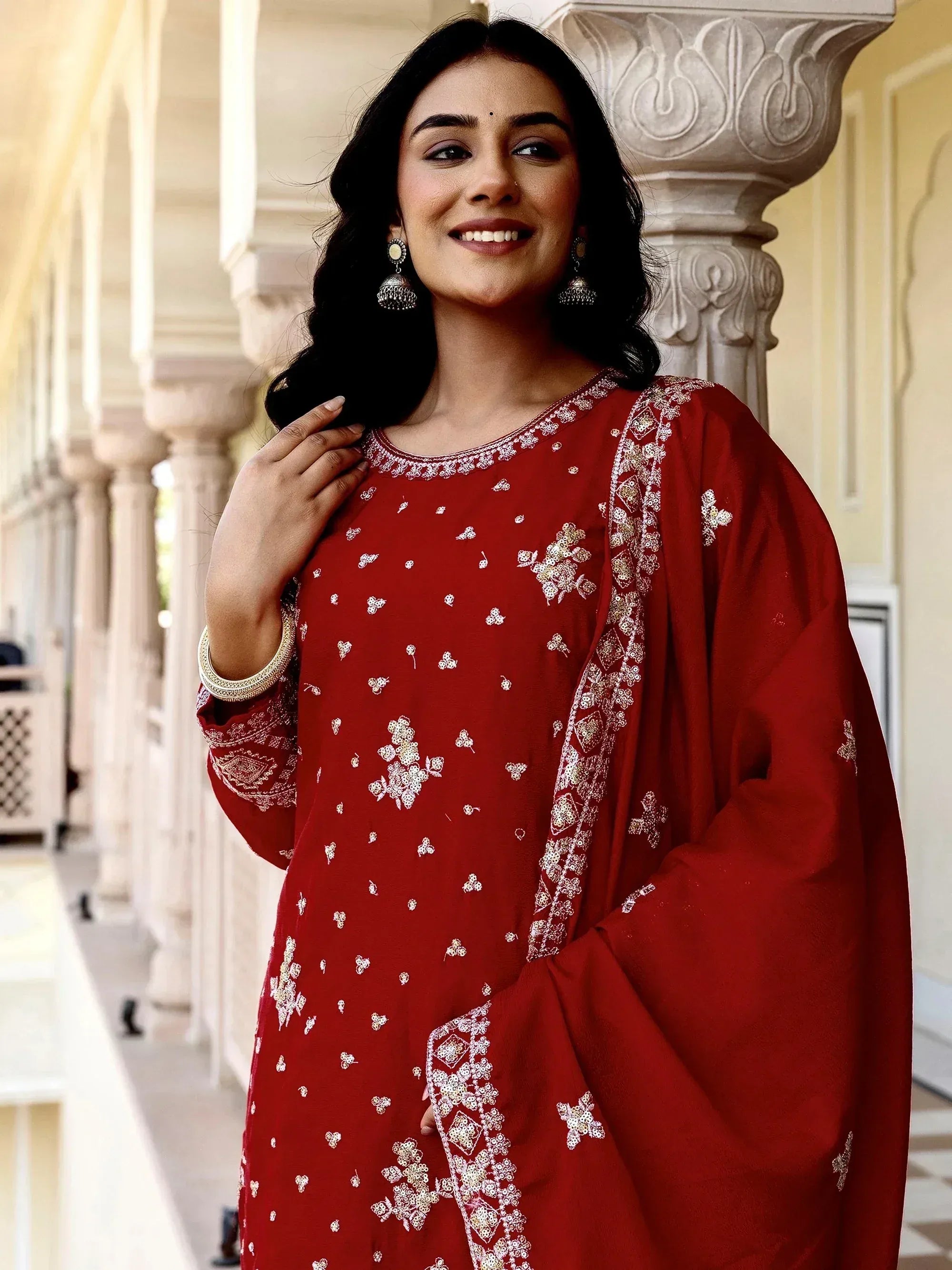 Red embroidered ethnic kurti with floral designs, perfect for Indian wear