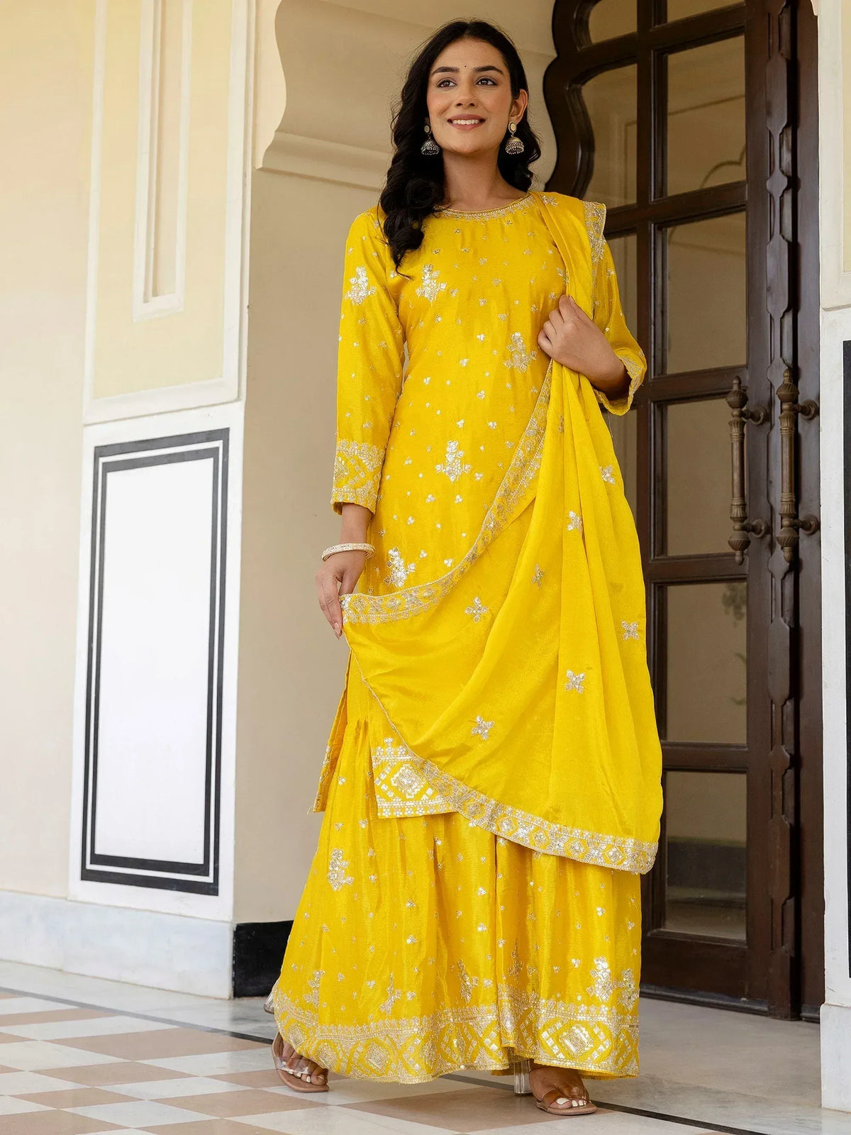 Yellow embroidered ethnic salwar kameez with floral patterns and dupatta