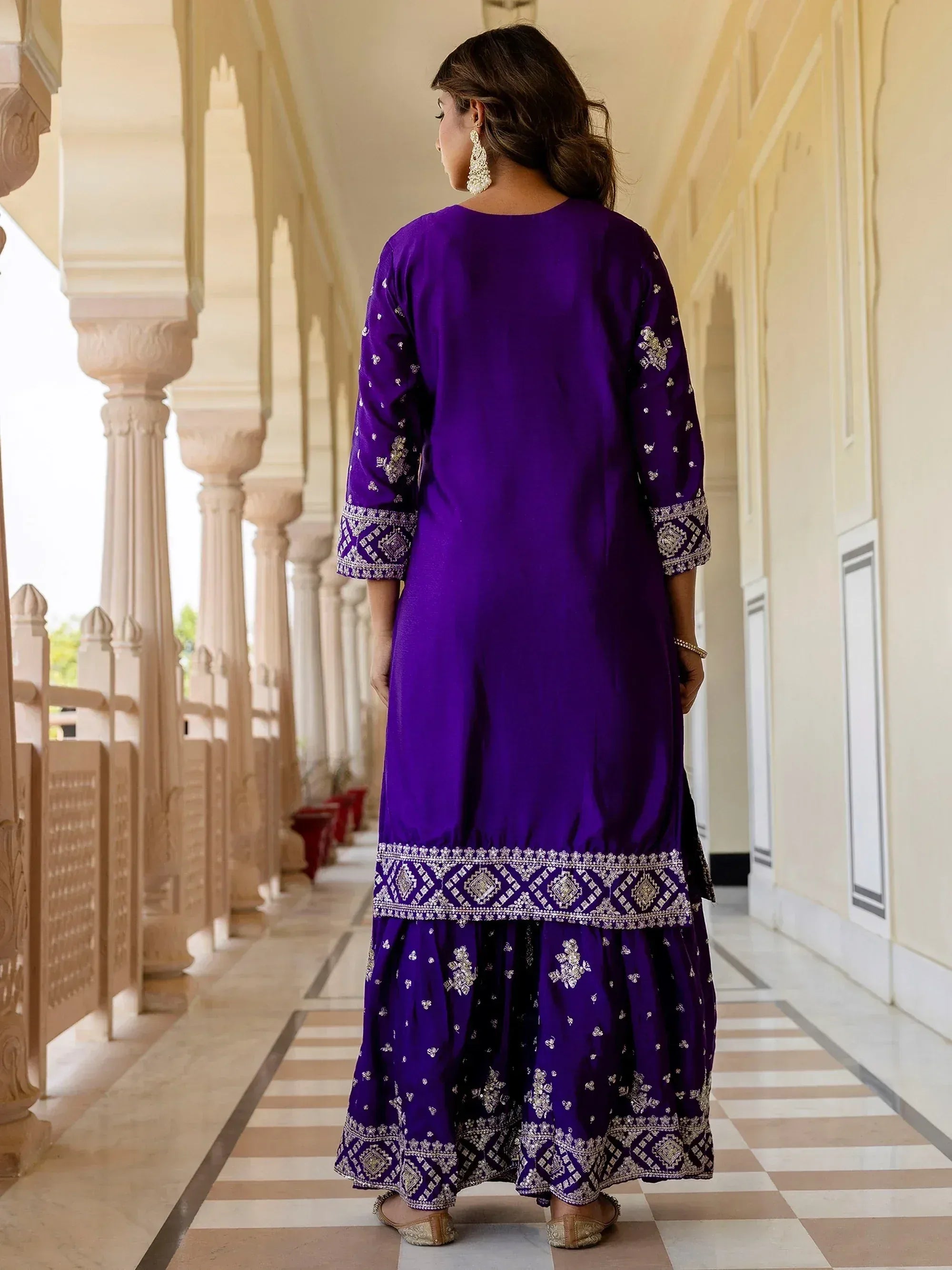 Purple embroidered ethnic kurta with flared skirt, perfect for Indian occasions and festive wear.