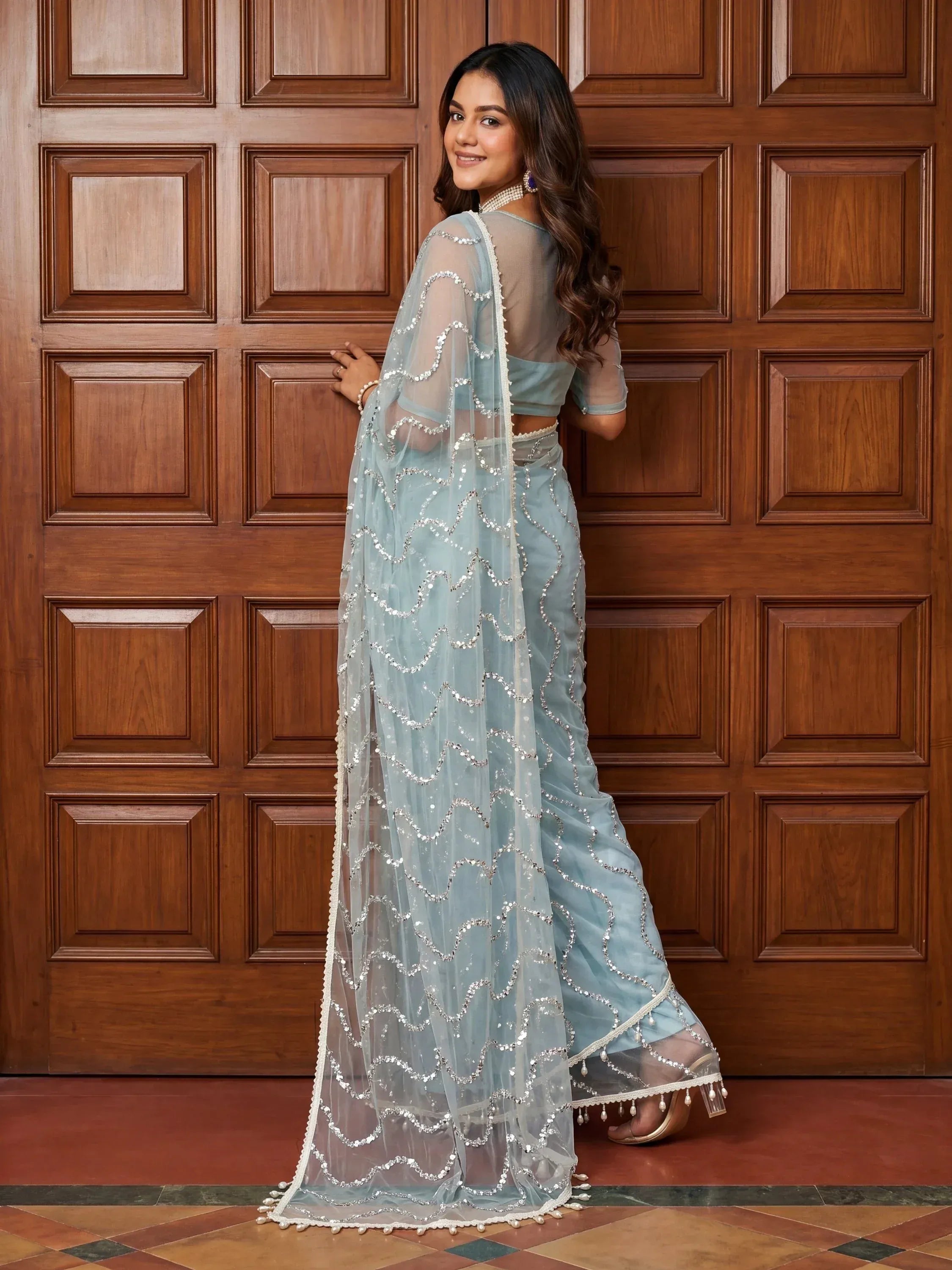 Wonderful Sky Blue Sequins Net Party Wear Saree With Blouse