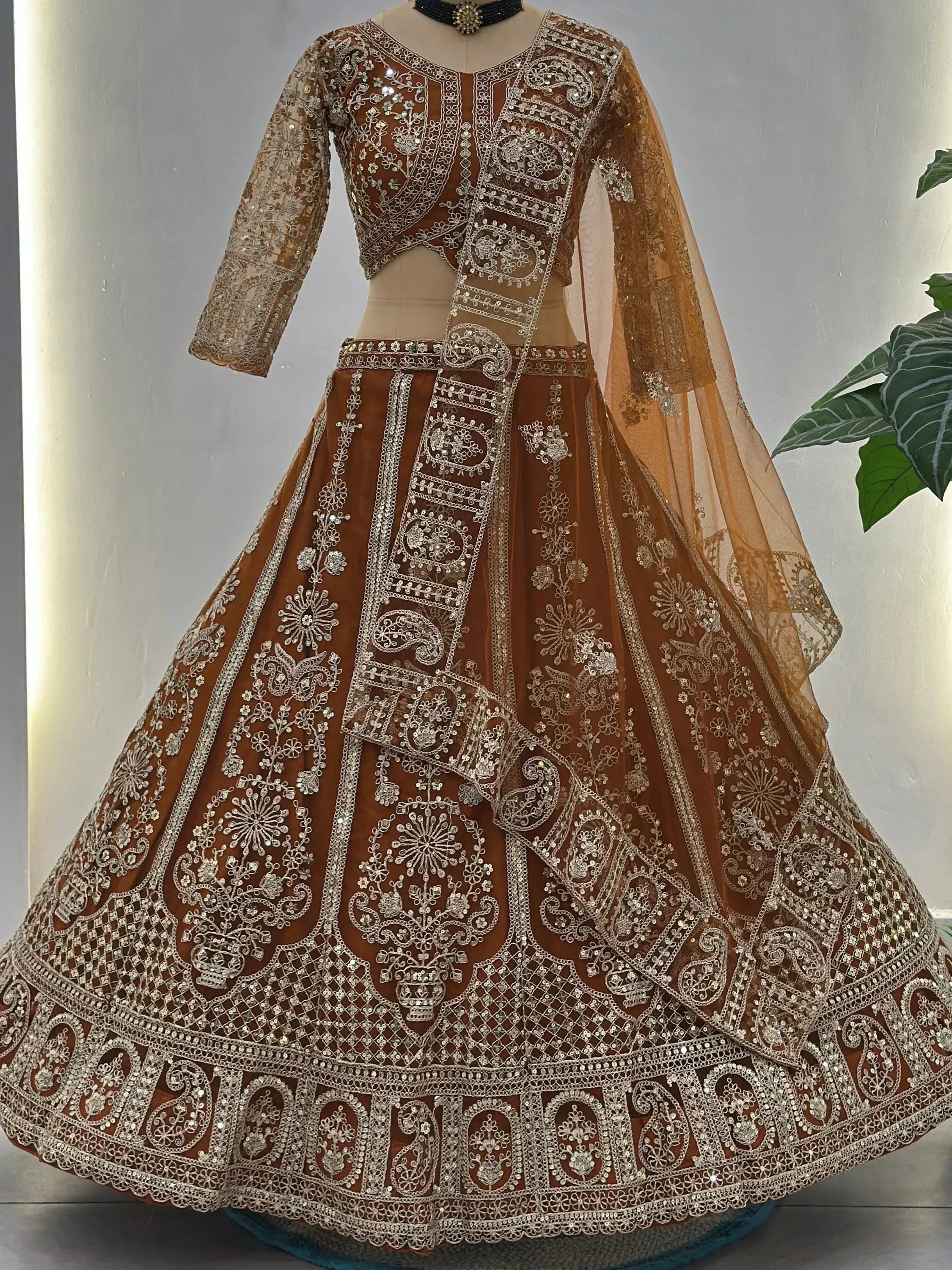 Fabulous Orange Embroidered Net Reception Wear Lehenga Choli