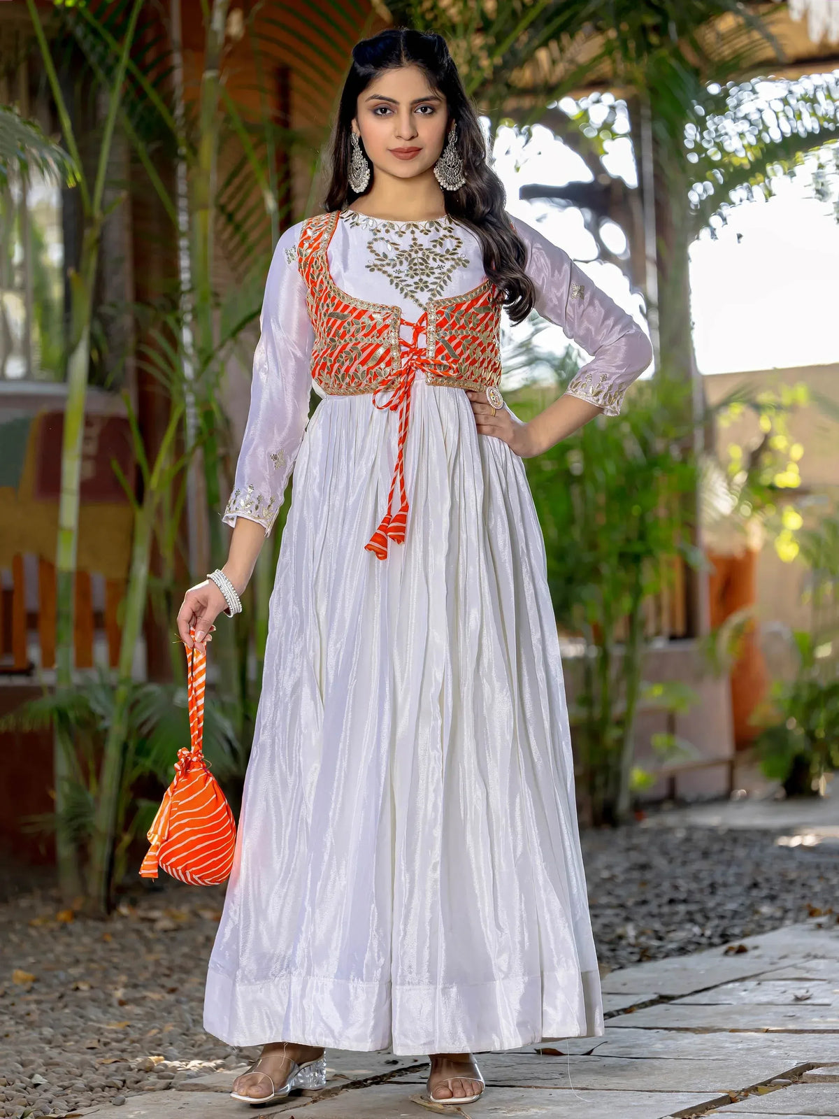 White ethnic gown with orange embroidered bodice, perfect for Indian festive occasions