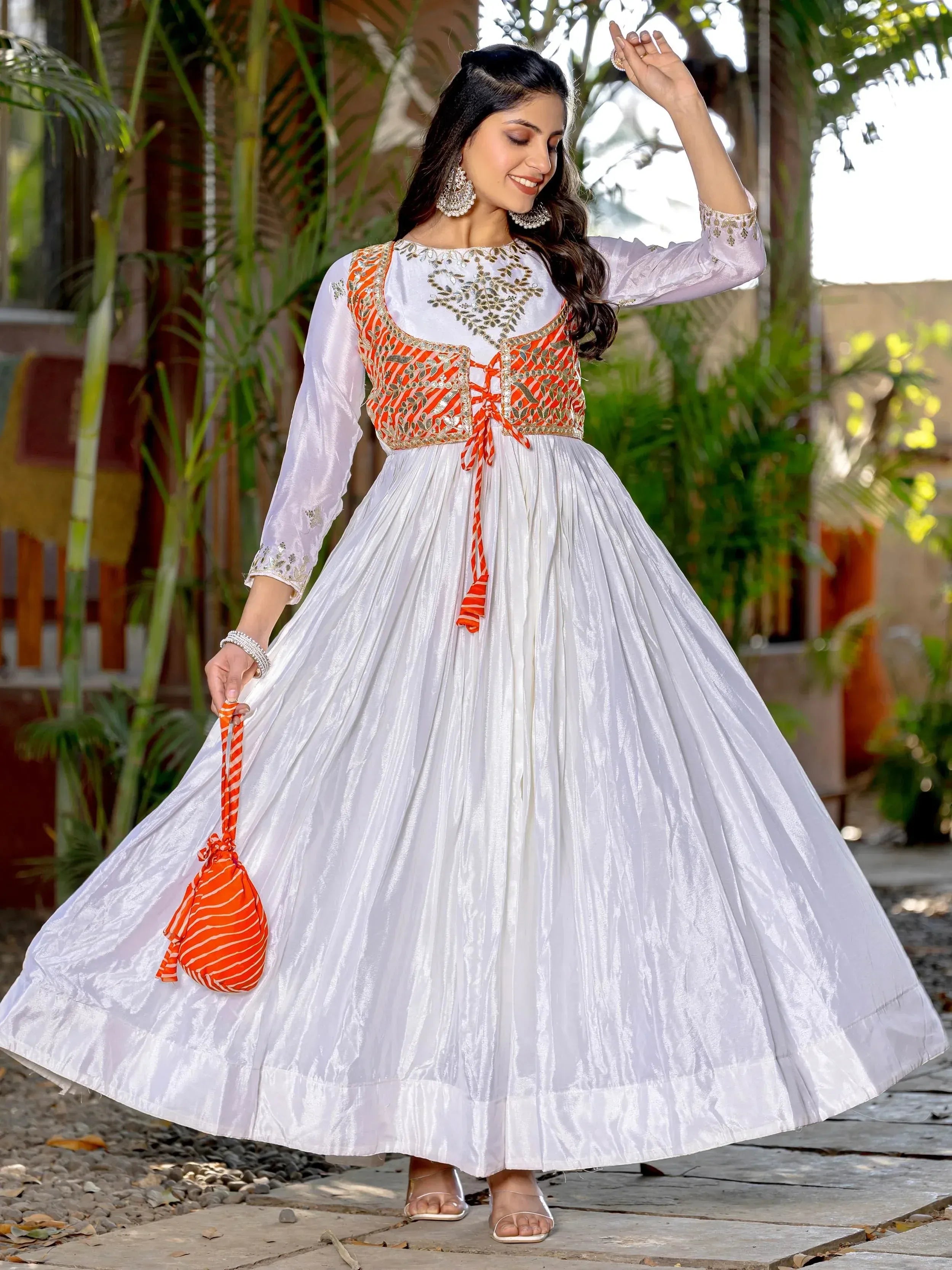 White ethnic gown with orange embroidered bodice, perfect for Indian festive occasions and celebrations