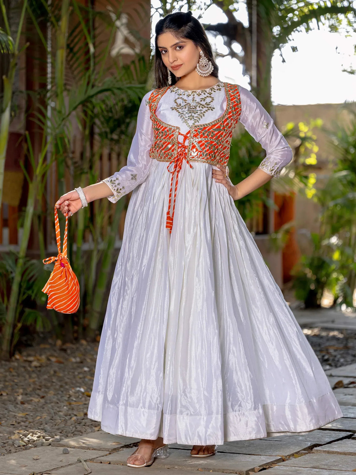 White ethnic gown with orange embroidered bodice, perfect for Indian festive occasions