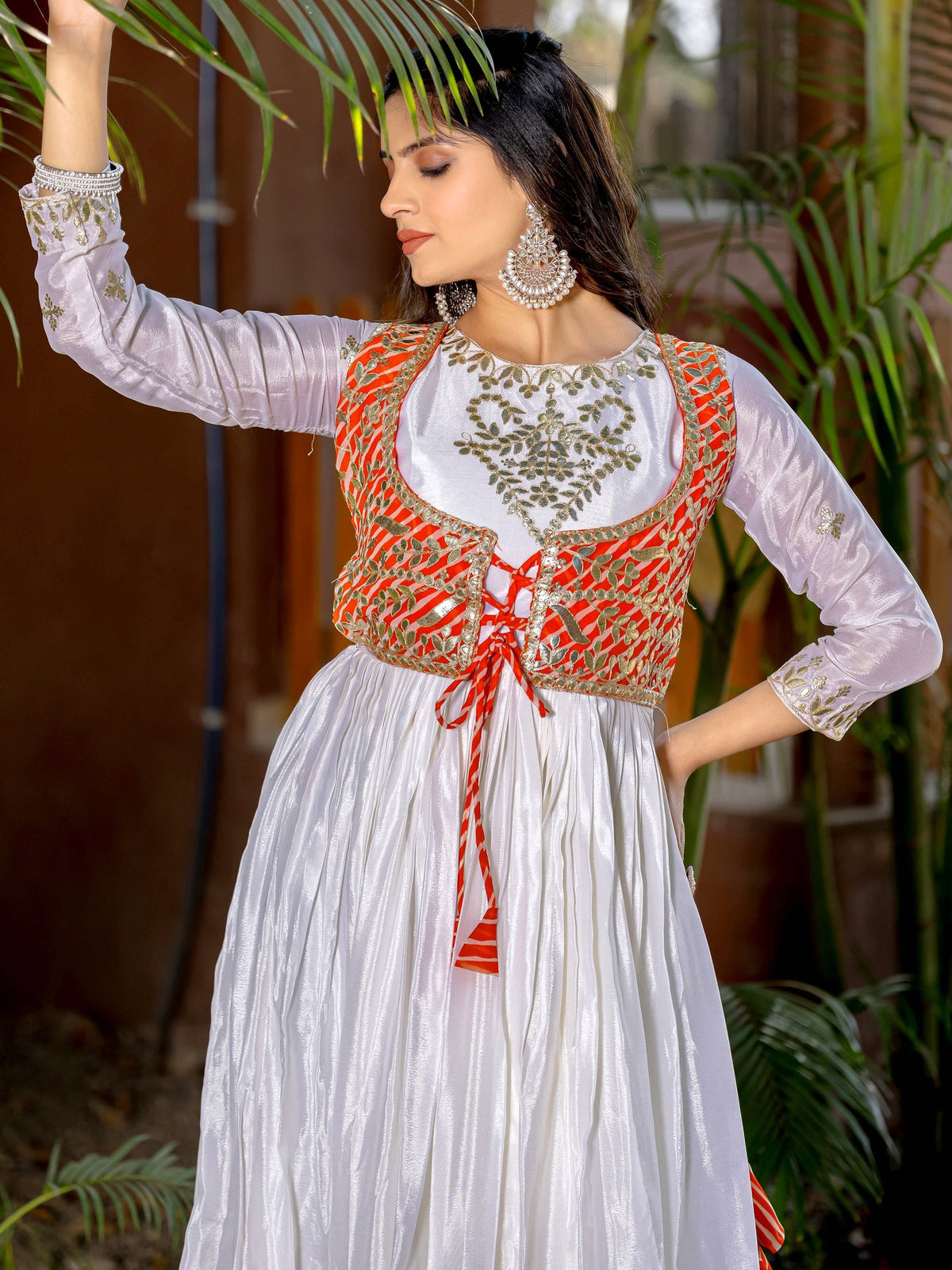 White ethnic gown with orange embroidered vest, perfect for Indian festive occasions
