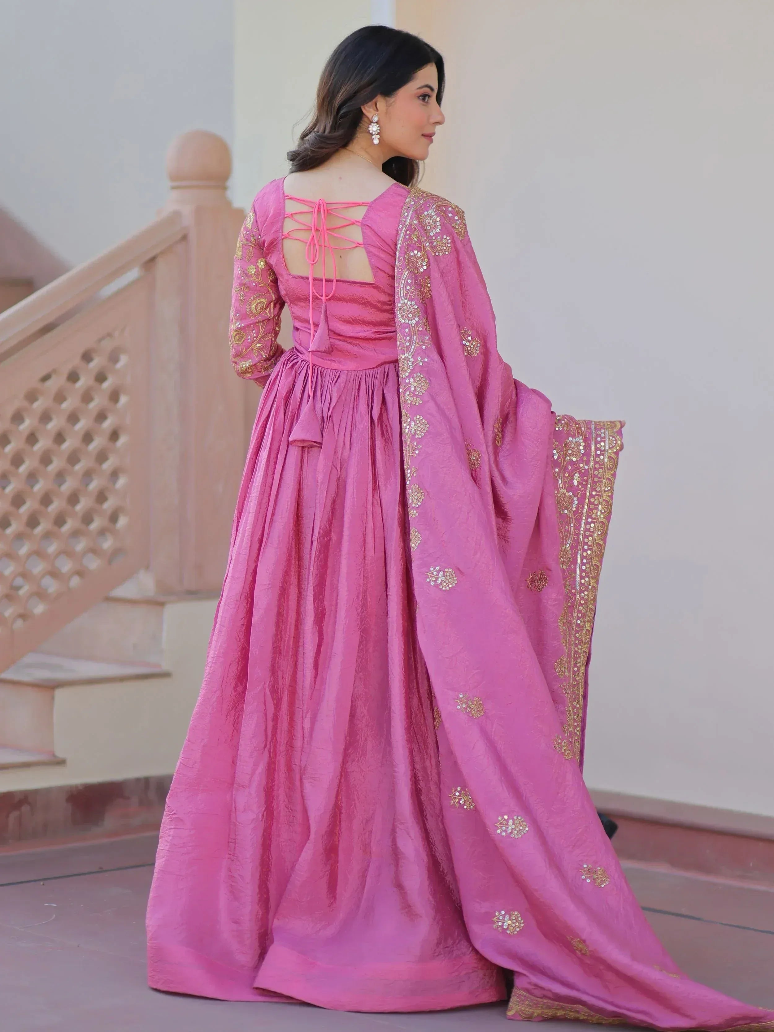 Pink embroidered anarkali gown with lace-up back and gold detailing, perfect for Indian ethnic occasions