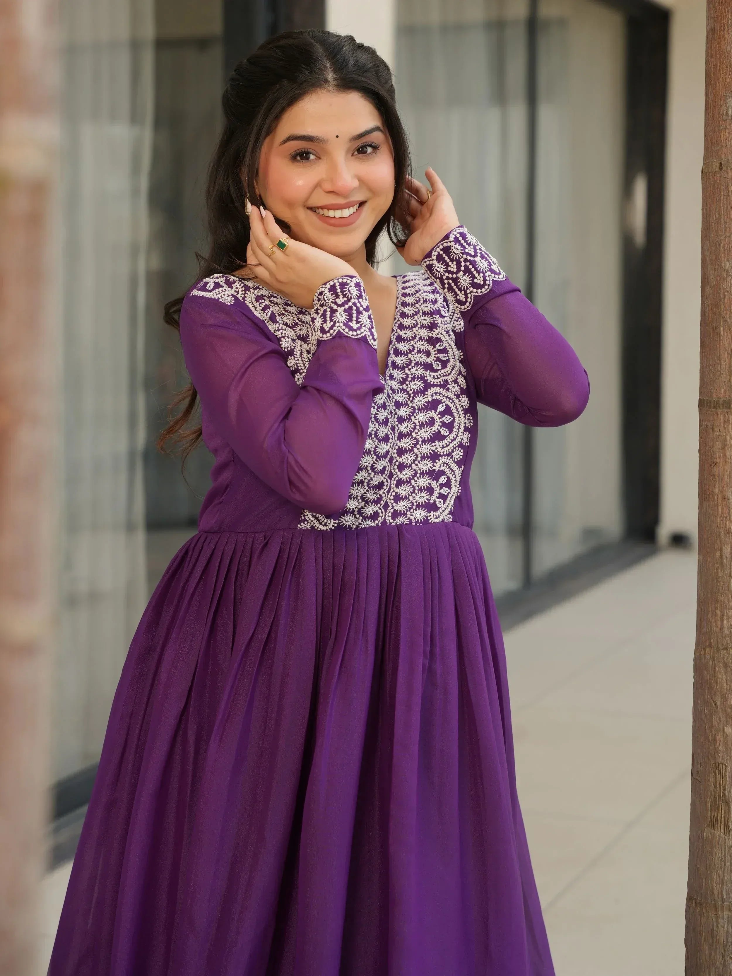 Purple ethnic gown with white embroidery, long sleeves, and pleated skirt for Indian wear