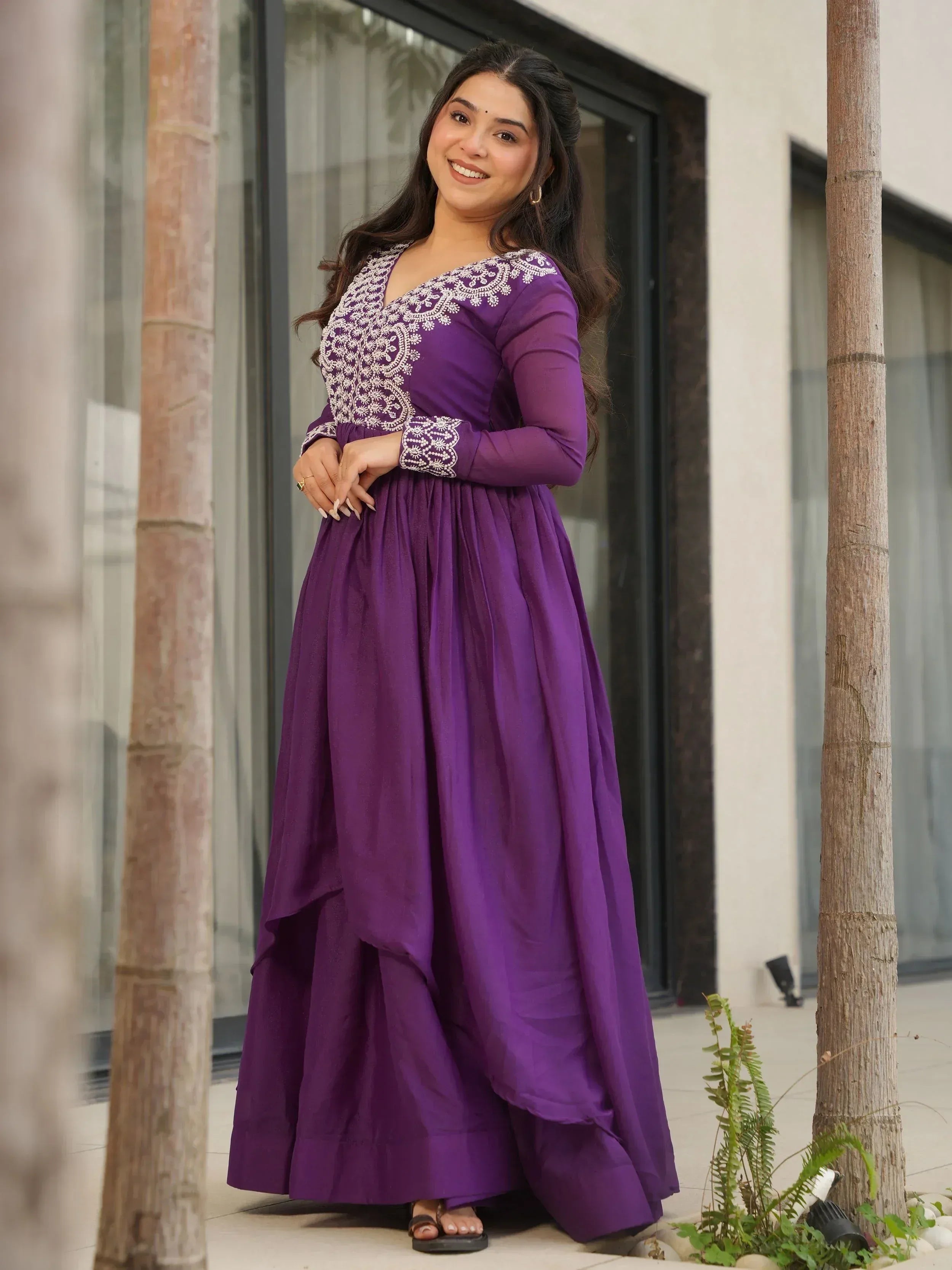 Purple ethnic gown with white embroidery, long sleeves, and flared skirt for women