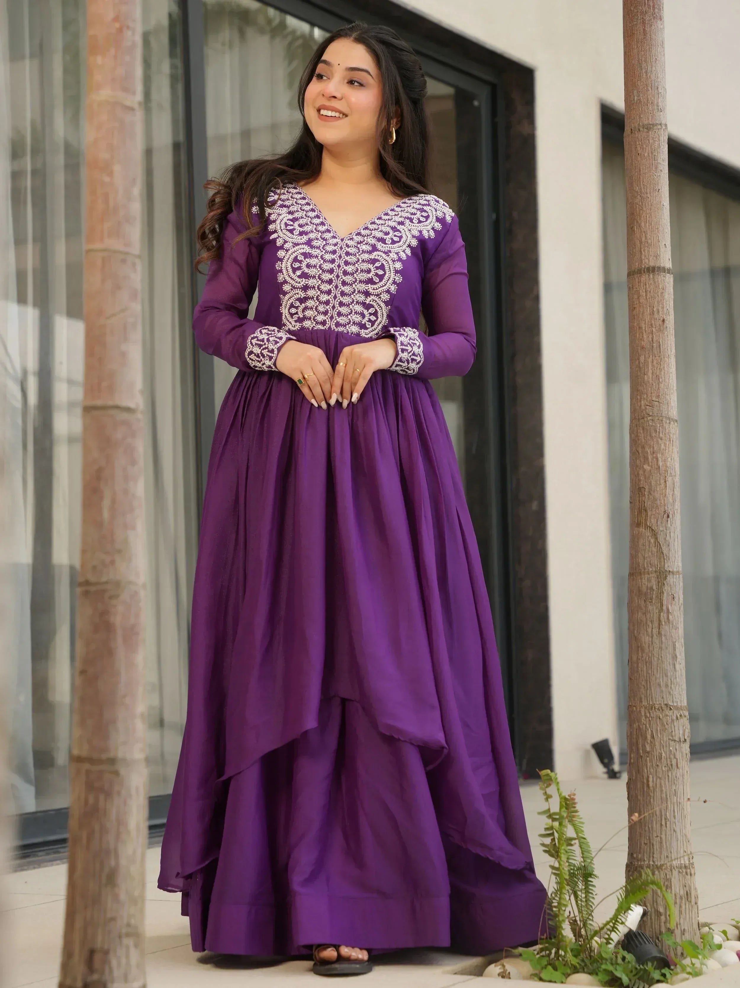 Purple ethnic gown with white embroidery, long sleeves, and layered skirt for women