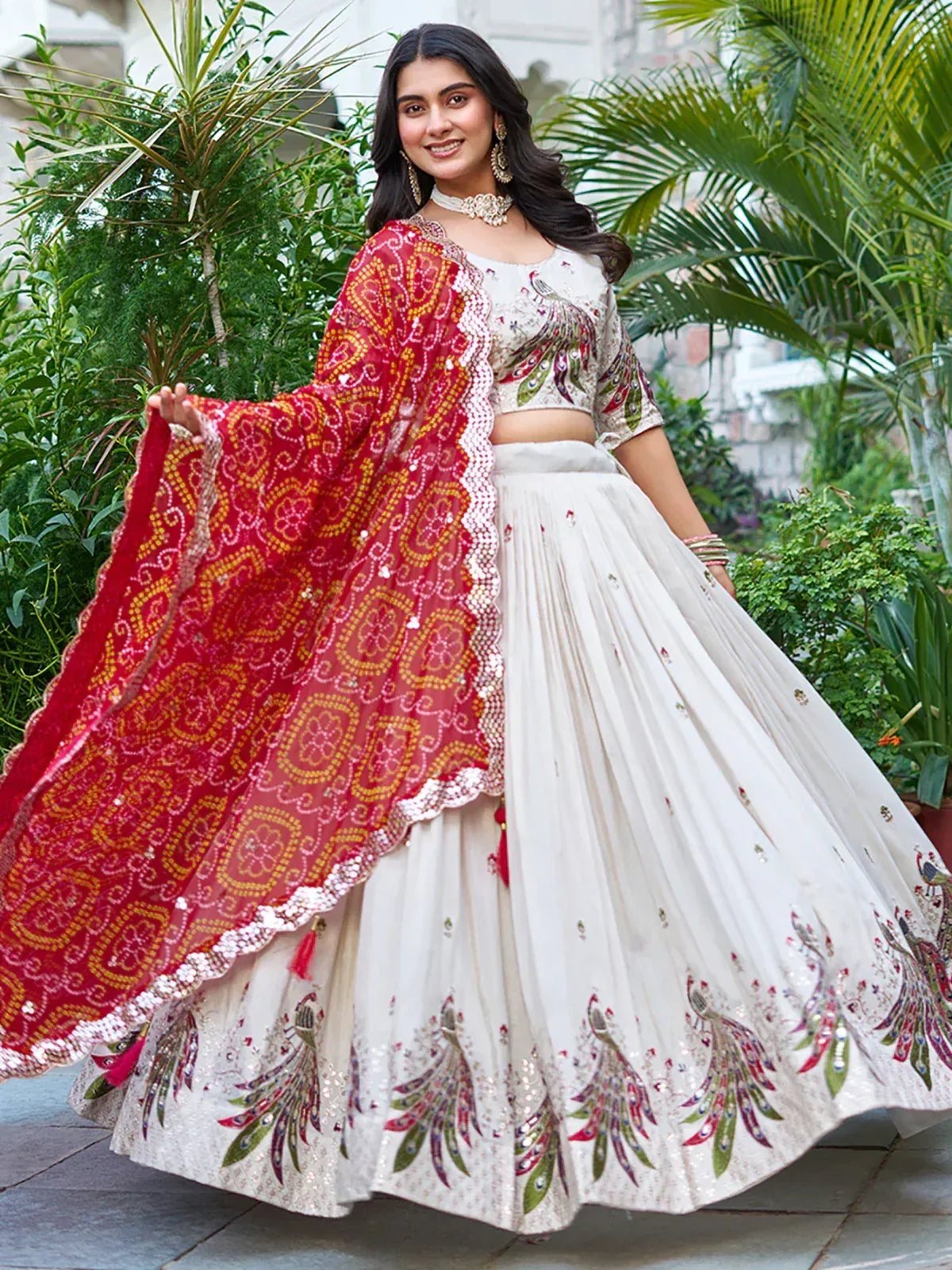 White peacock-embroidered lehenga choli with red dupatta, perfect for Indian ethnic wear occasions