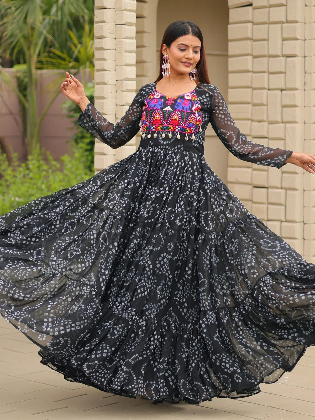 Black ethnic gown with colorful embroidery and sheer sleeves, perfect for Indian occasions
