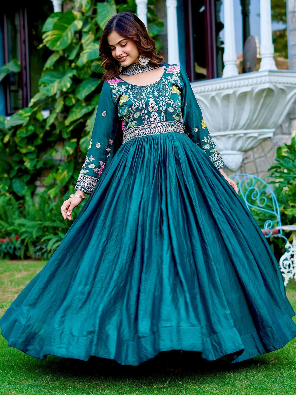 Teal embroidered ethnic gown with floral detailing, perfect for Indian occasions and festive wear.