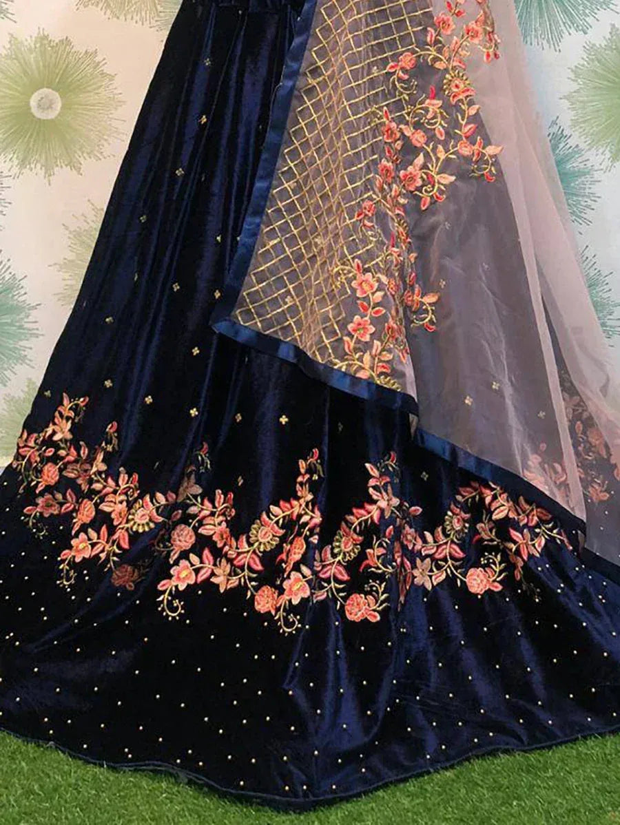 Navy blue velvet lehenga with floral embroidery and sheer dupatta, perfect for Indian ethnic wear occasions
