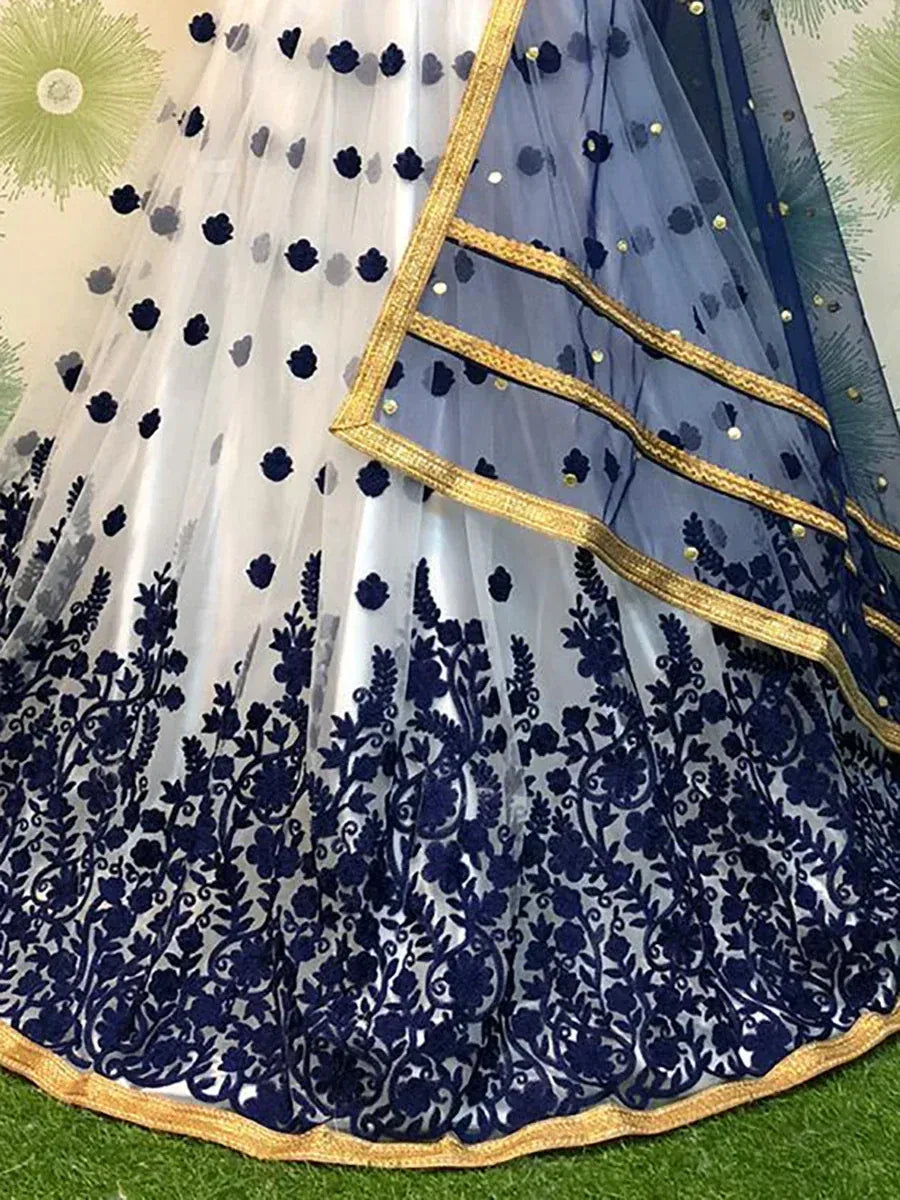 Navy blue and white embroidered lehenga with gold trim, floral lace detailing, perfect for Indian ethnic wear