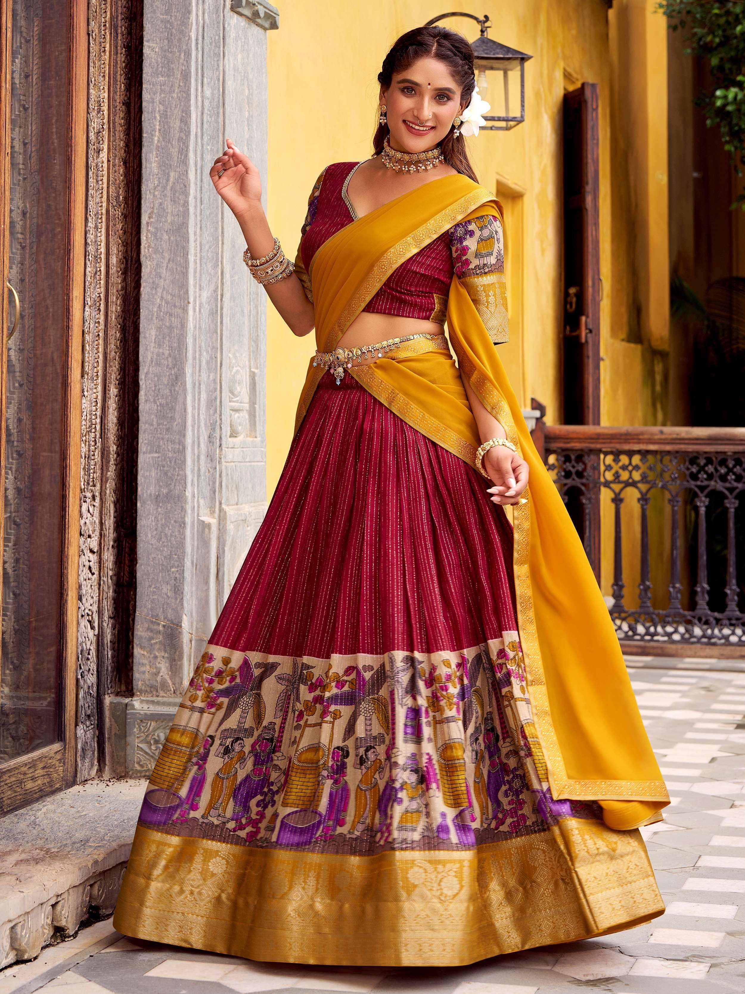 Maroon and mustard Indian lehenga choli with printed border, perfect for ethnic occasions and festive wear.