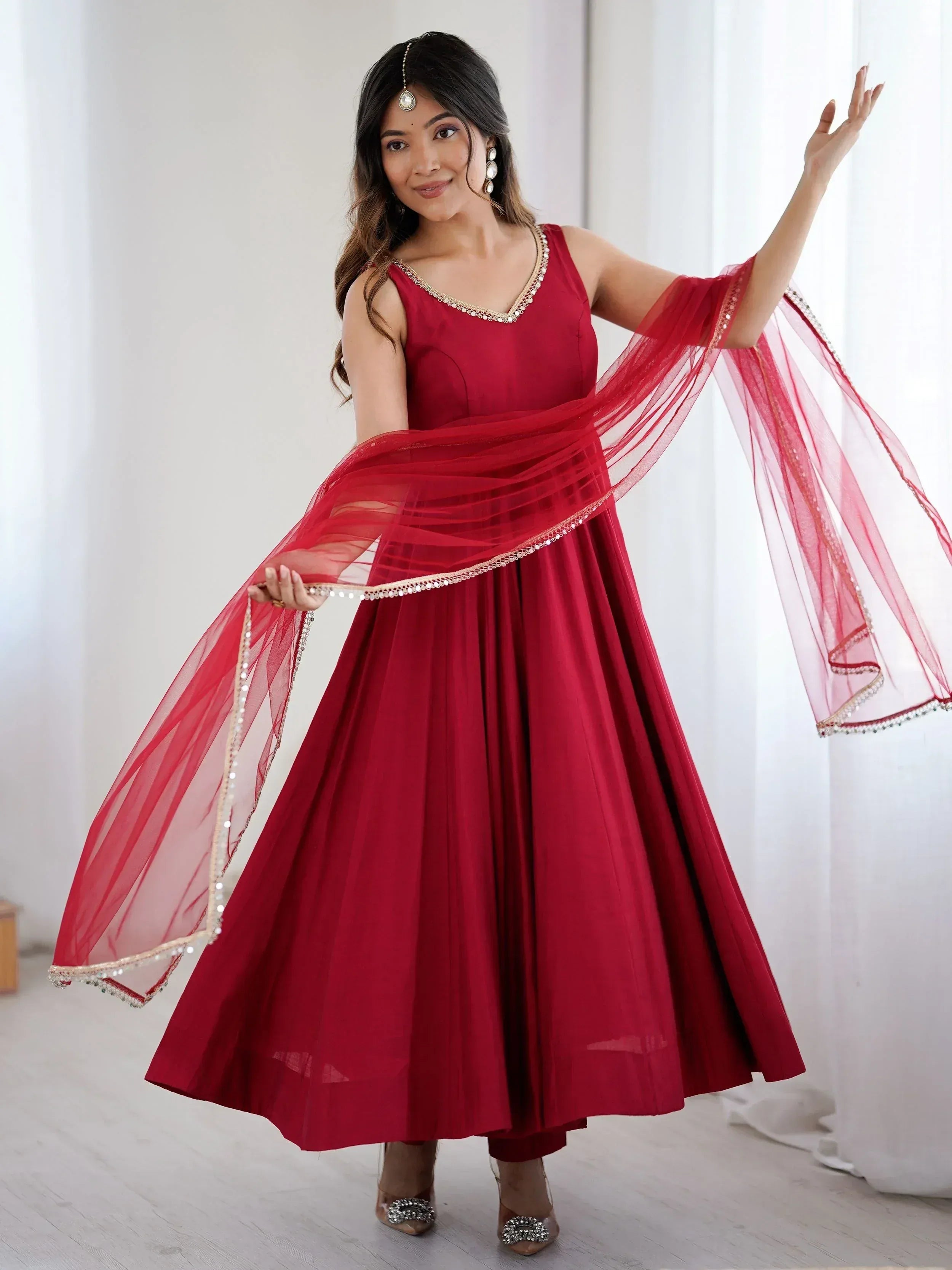 Red ethnic gown with sheer dupatta, perfect for Indian weddings and festive occasions