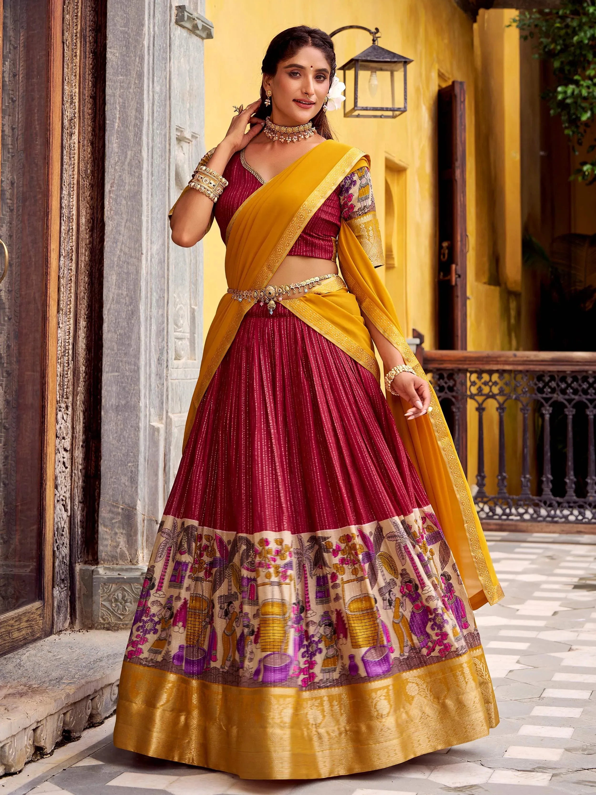 Maroon and yellow designer lehenga choli with printed border, perfect for Indian ethnic wear occasions
