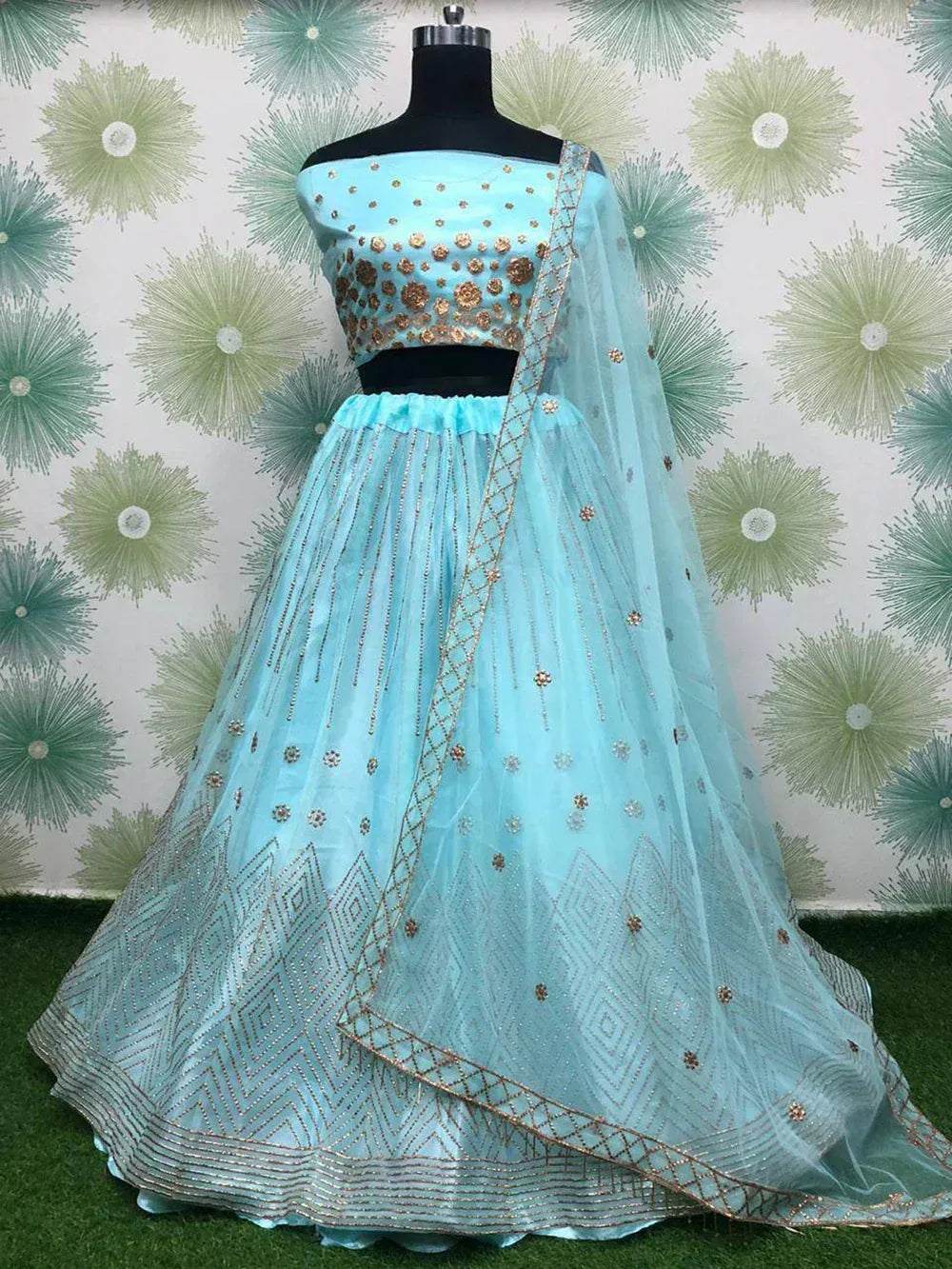 Light blue designer lehenga choli with gold embroidery, perfect for Indian ethnic wear occasions
