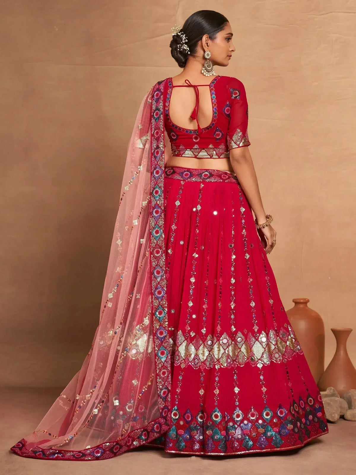 Red embroidered lehenga choli with mirror work and pink dupatta, perfect for Indian weddings and festive occasions