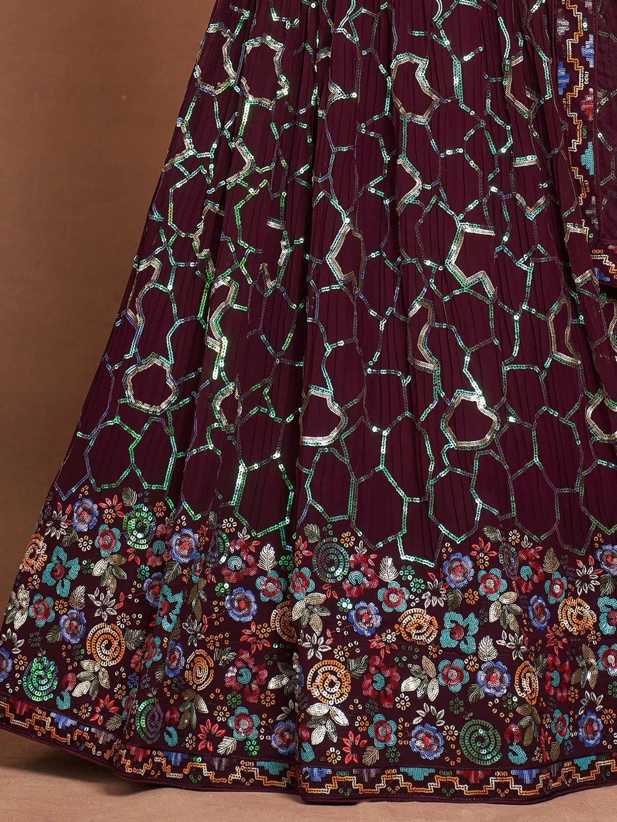 Maroon lehenga with geometric and floral embroidery, perfect for ethnic occasions.