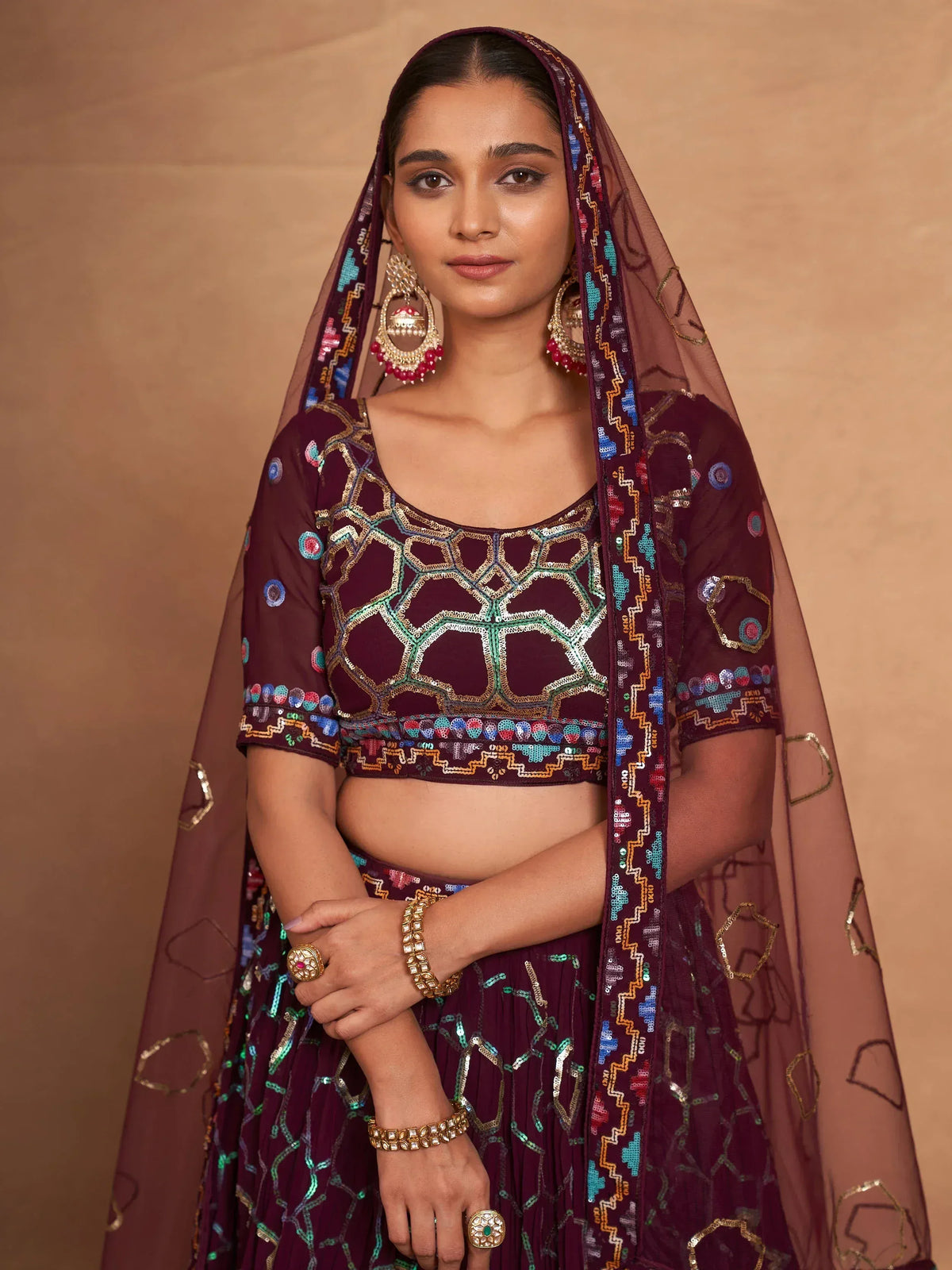 Elegant maroon lehenga choli with geometric embroidery and matching dupatta for Indian ethnic wear