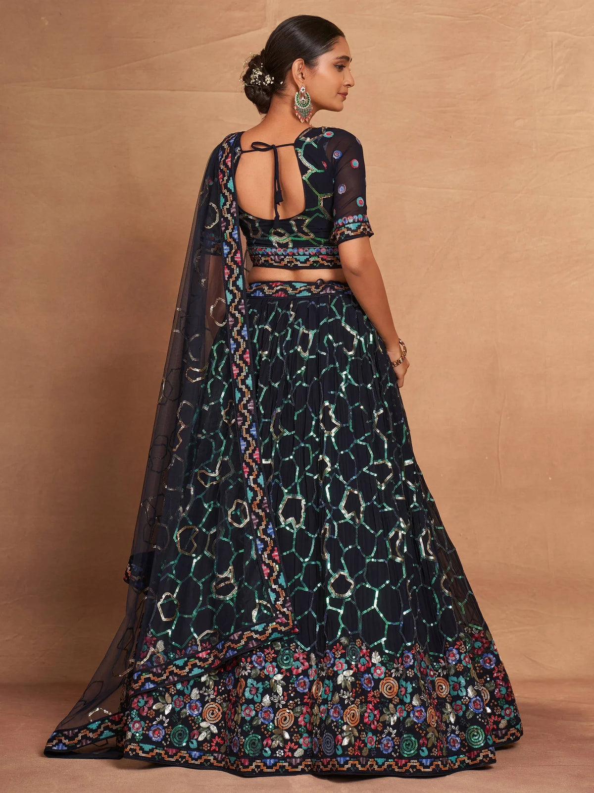 Black embroidered lehenga choli with floral and geometric patterns, perfect for Indian ethnic wear