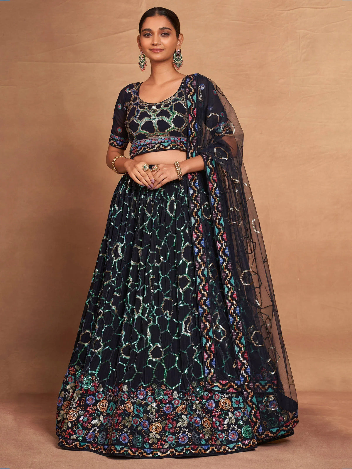 Black embroidered lehenga choli with geometric and floral motifs, perfect for Indian ethnic wear occasions.