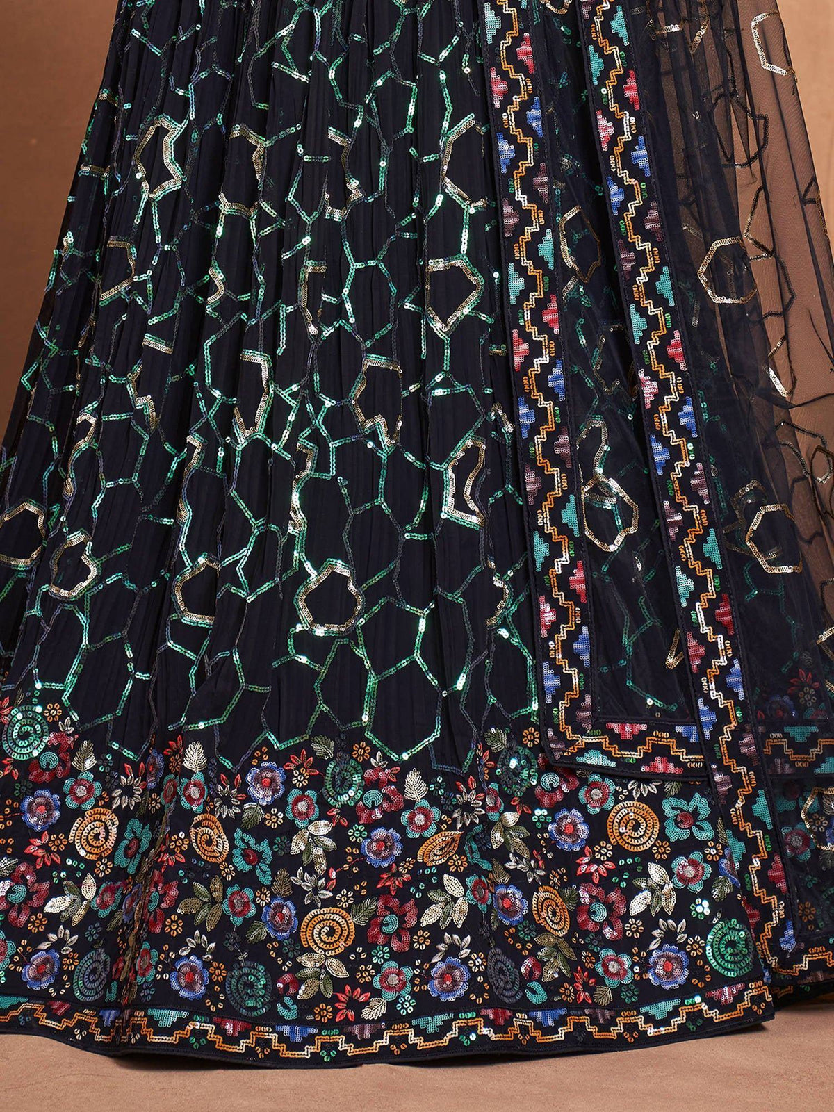 Black lehenga with colorful floral and geometric embroidery, perfect for ethnic wear.