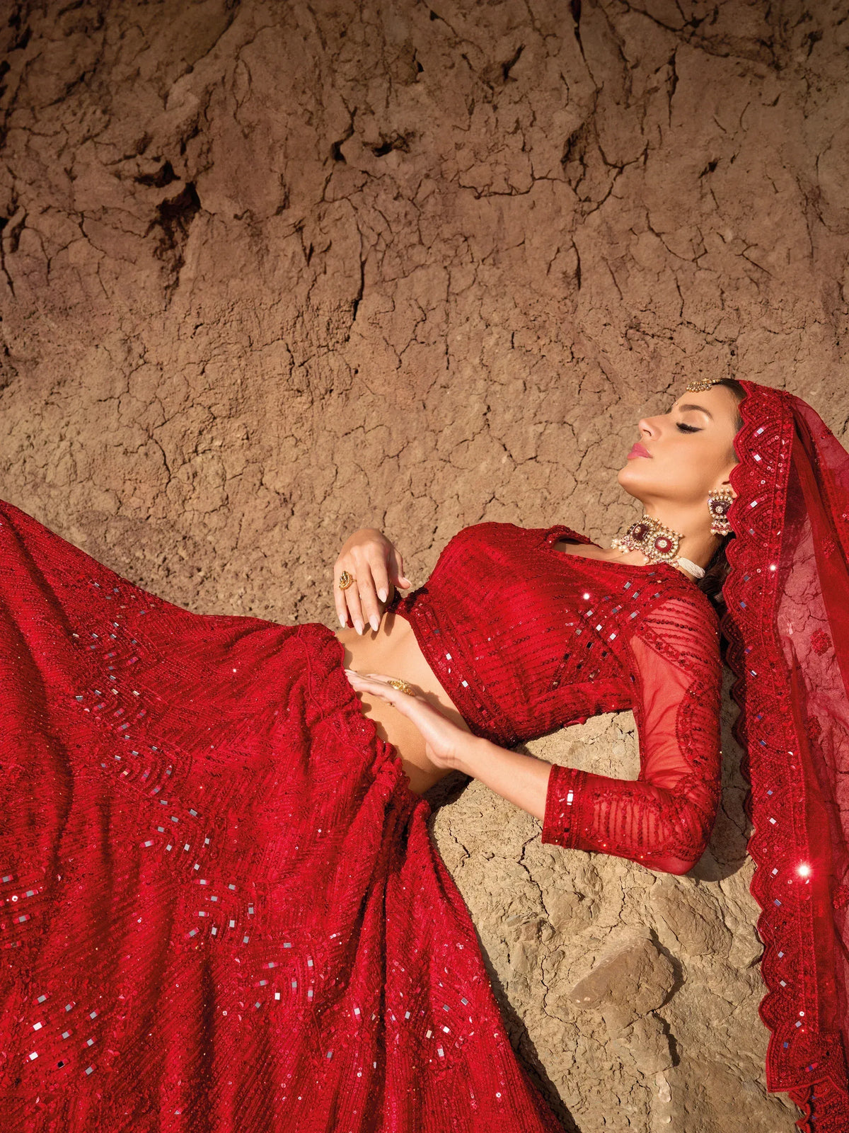 Red sequined lehenga choli with matching dupatta, styled for Indian ethnic wear