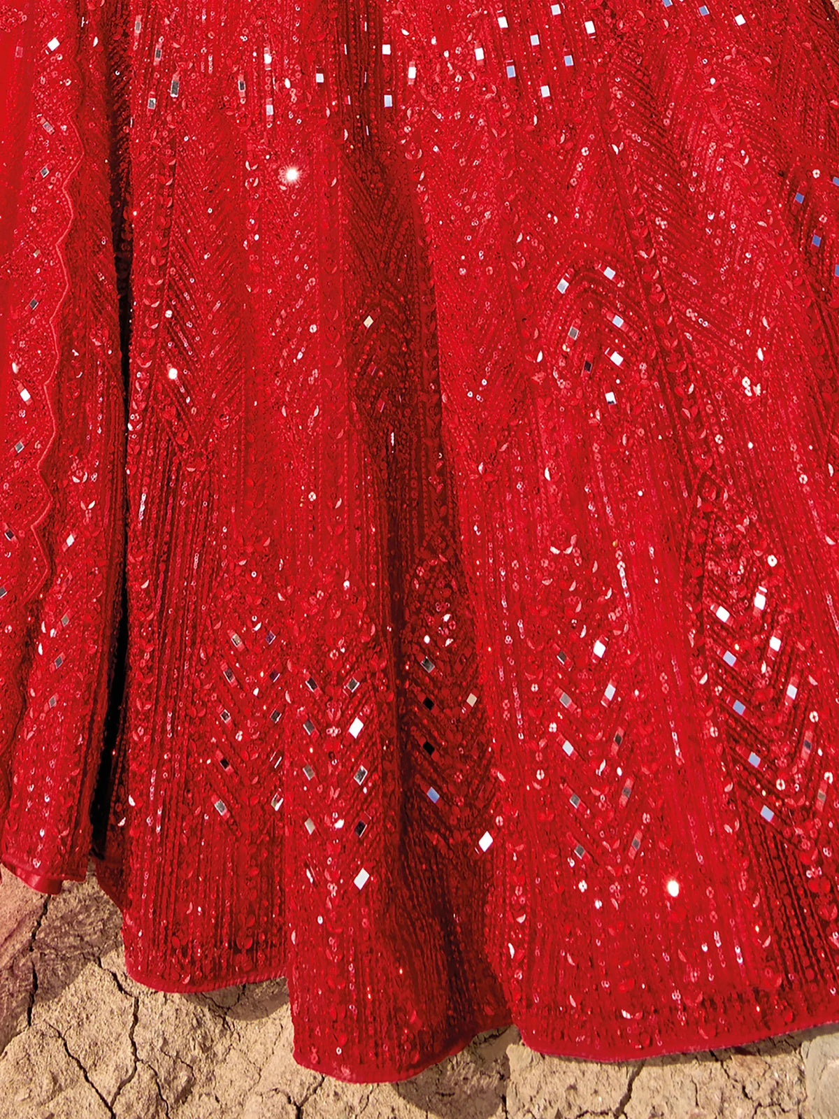 Red sequined ethnic gown with intricate mirror work and geometric patterns