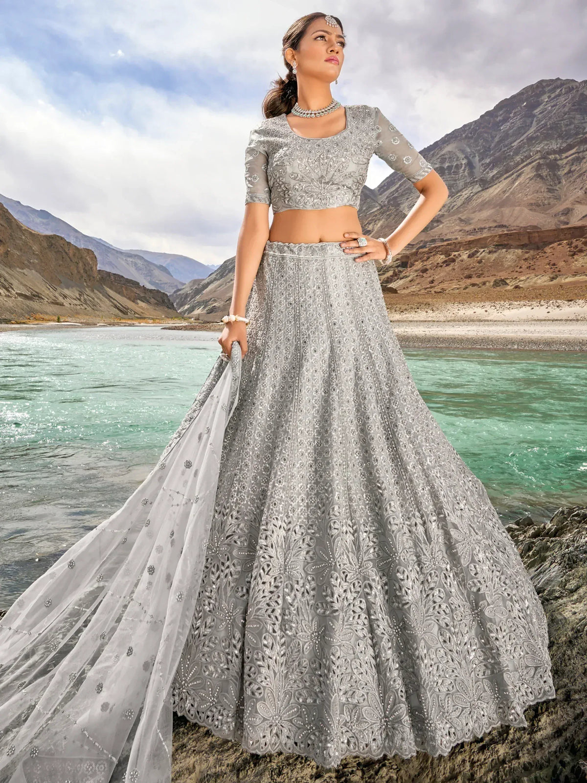 Elegant silver lehenga choli with intricate embroidery, perfect for Indian ethnic wear occasions.