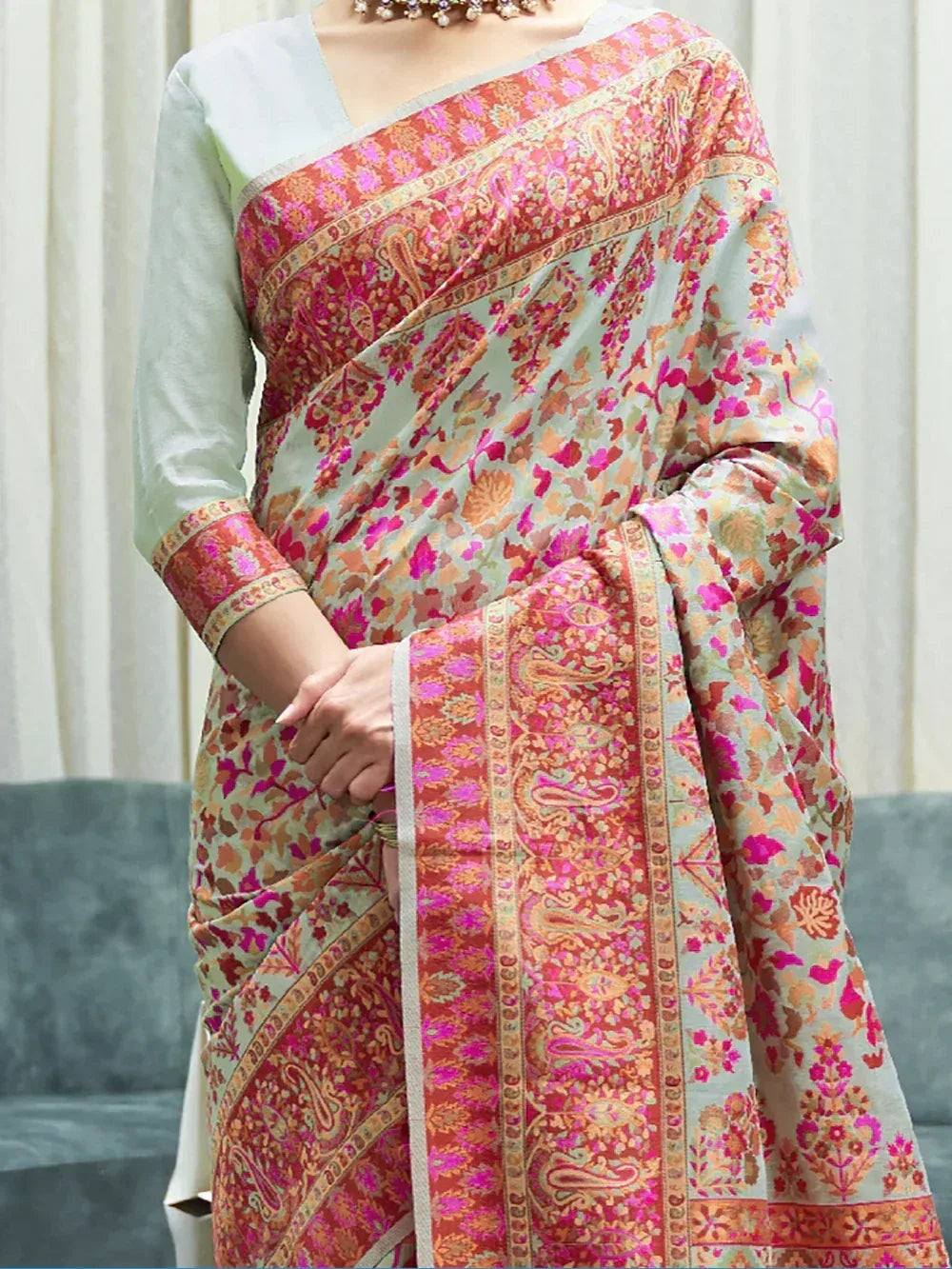 Floral printed saree with paisley border, paired with light green blouse, ethnic Indian wear