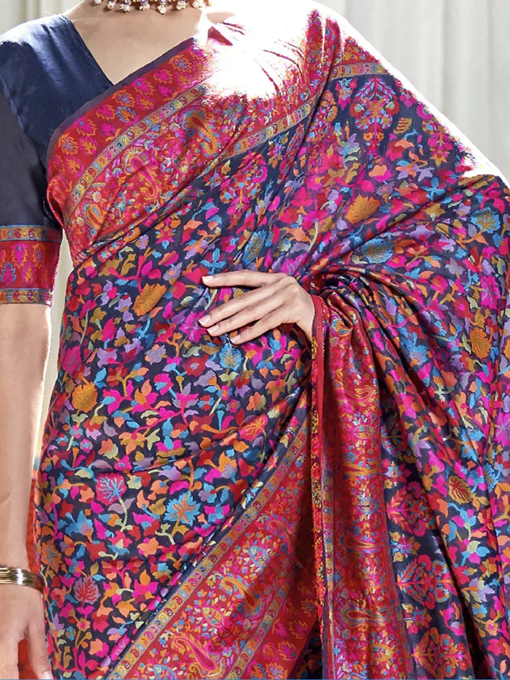 Vibrant floral print saree with rich red border, perfect for Indian ethnic wear occasions