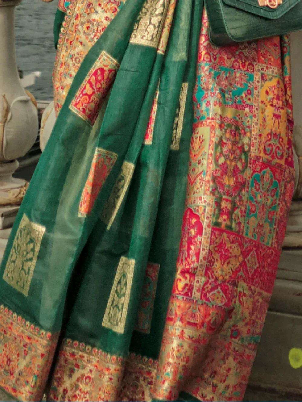 Vibrant Indian ethnic saree with green border and colorful patchwork print, perfect for festive occasions