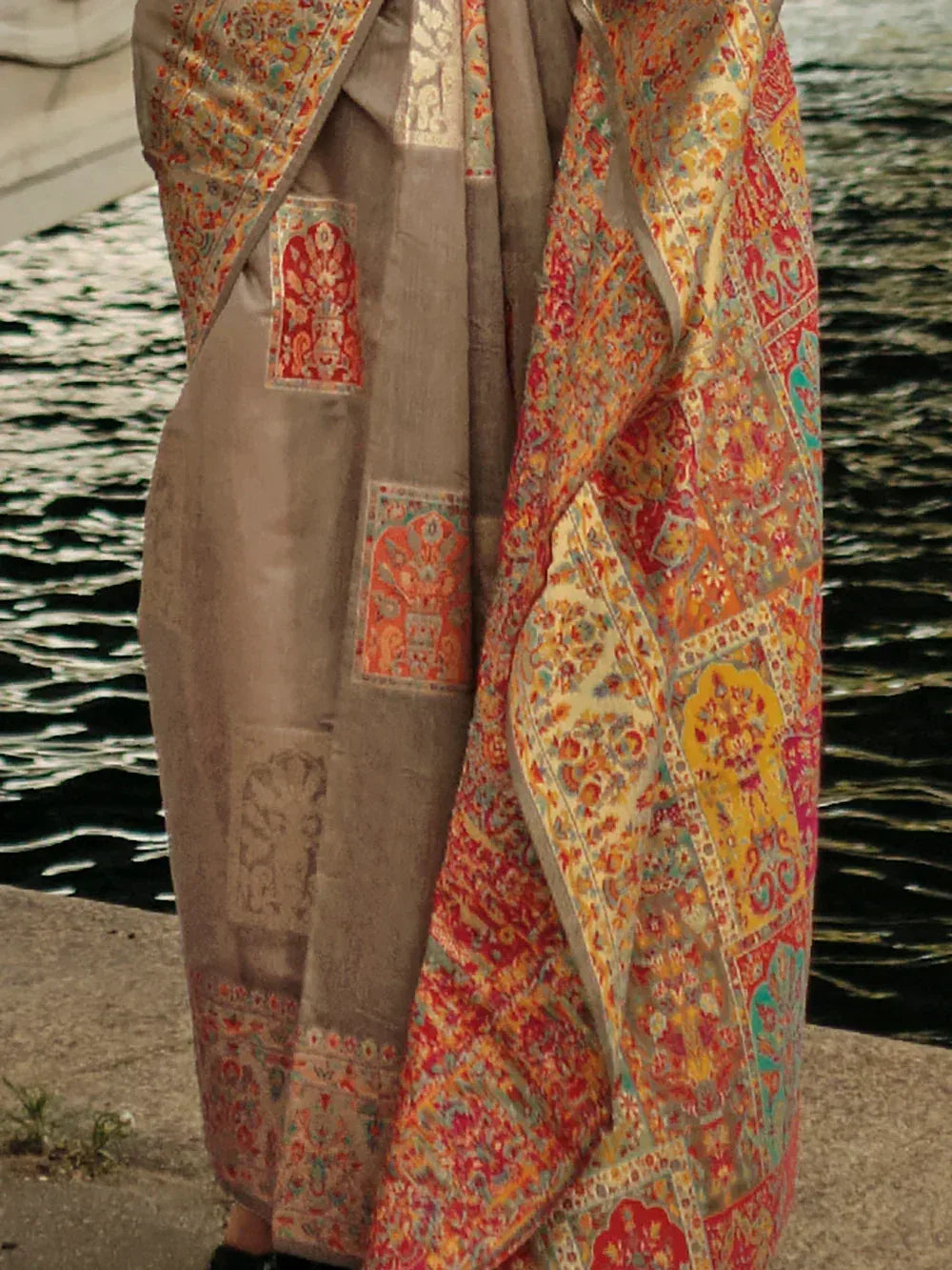 Elegant Indian ethnic saree with vibrant floral and paisley patterns, perfect for festive occasions.