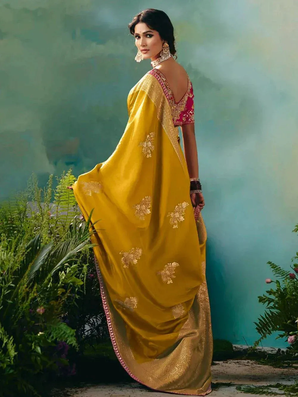 Yellow embroidered saree with pink blouse, perfect for Indian ethnic wear occasions
